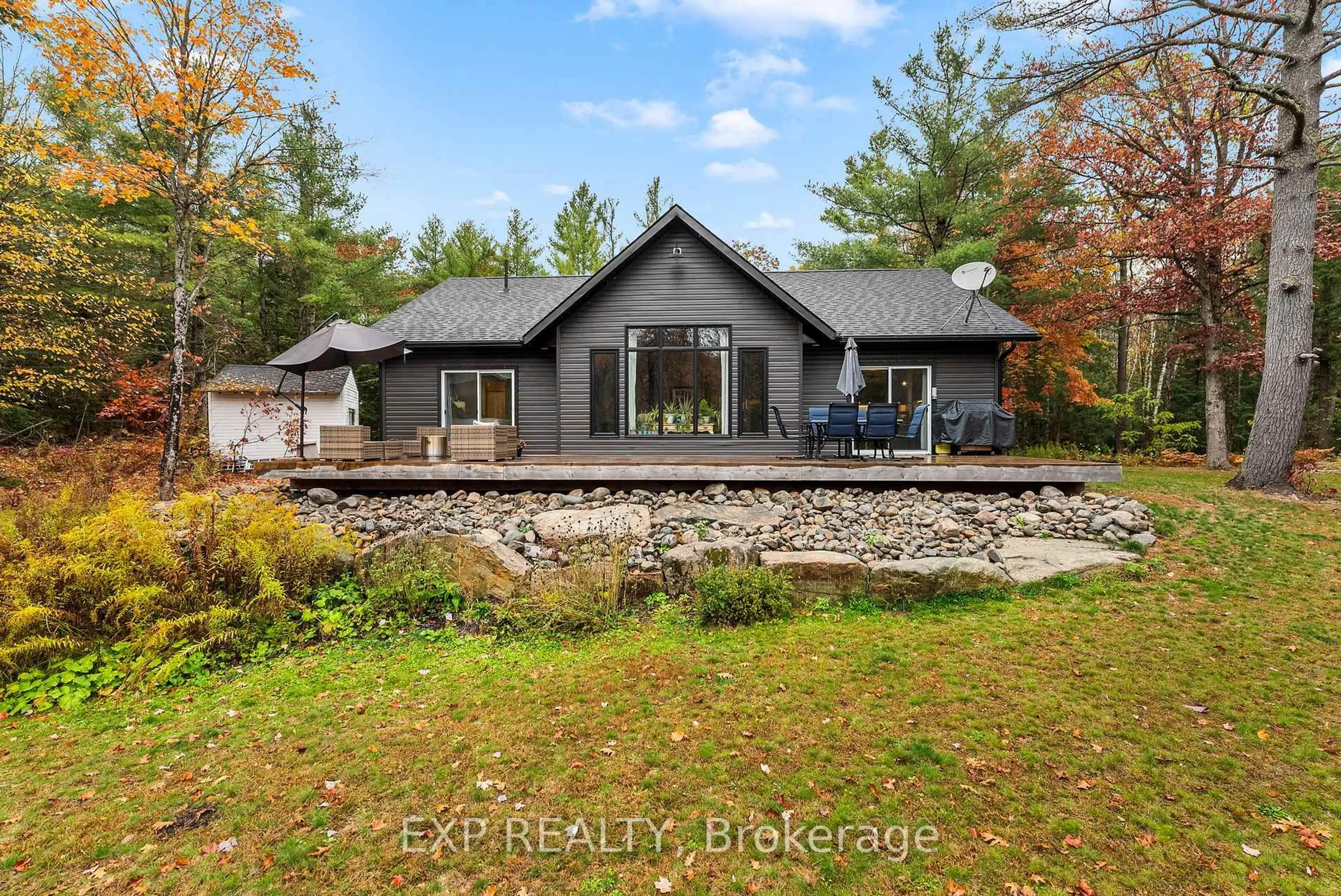 A pic from outside/outdoor area/front of a property/back of a property/a pic from drone, water/lake/river/ocean view for 1698 Reay Rd, Bracebridge Ontario P1P 1R3