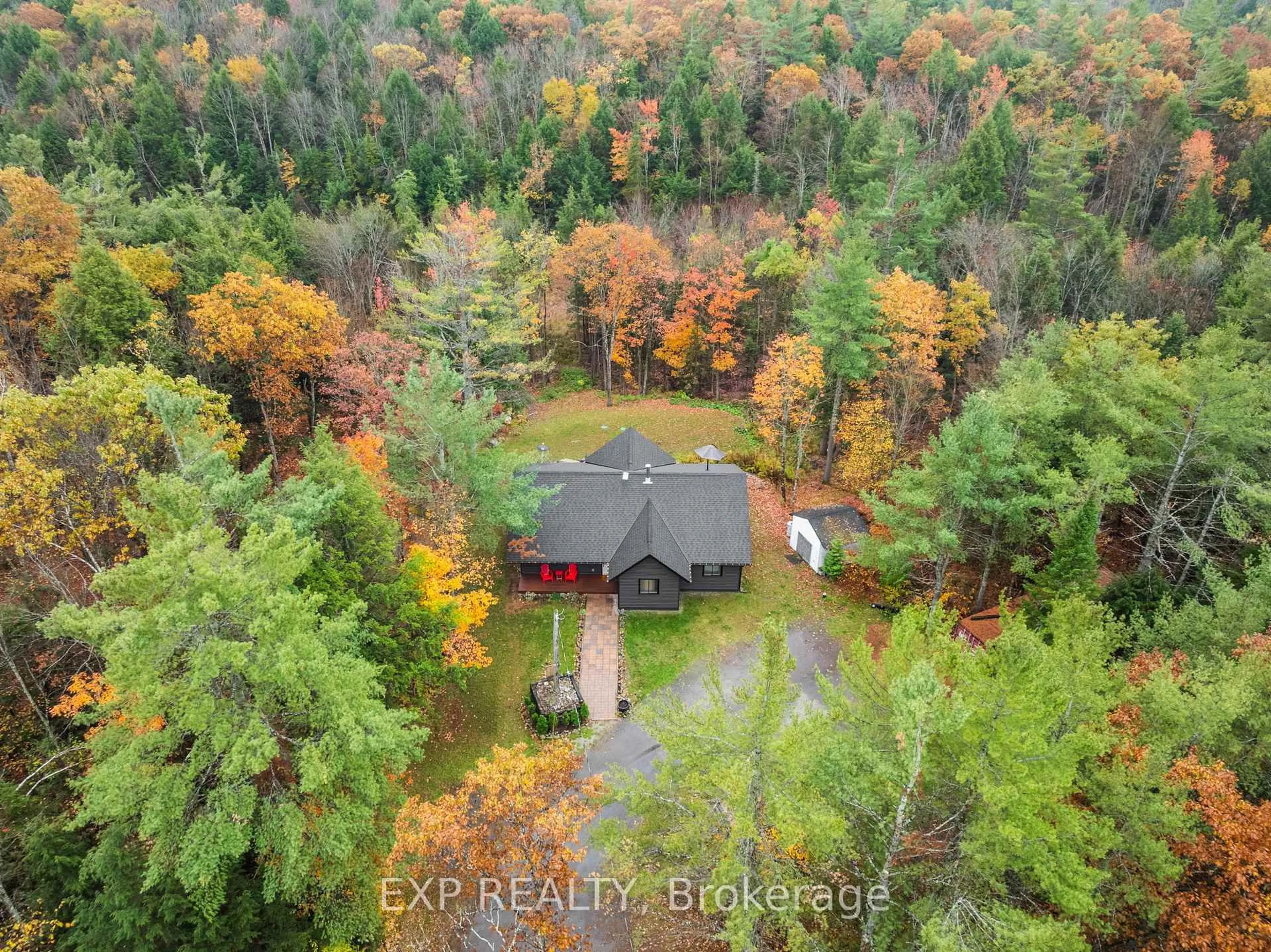 A pic from outside/outdoor area/front of a property/back of a property/a pic from drone, forest/trees view for 1698 Reay Rd, Bracebridge Ontario P1P 1R3