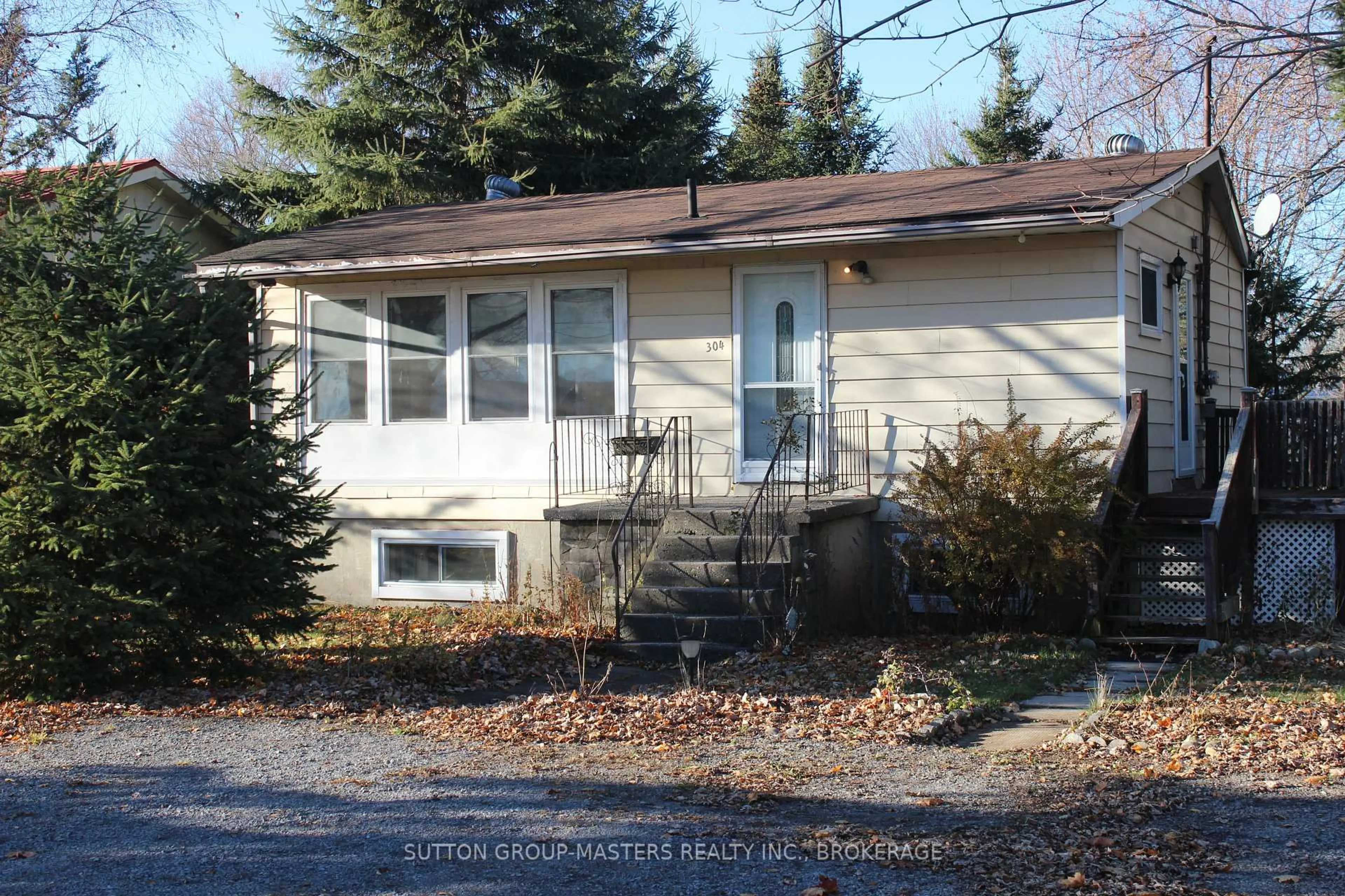 Home with vinyl exterior material, street for 304 Main St, Bath Ontario K0H 1G0