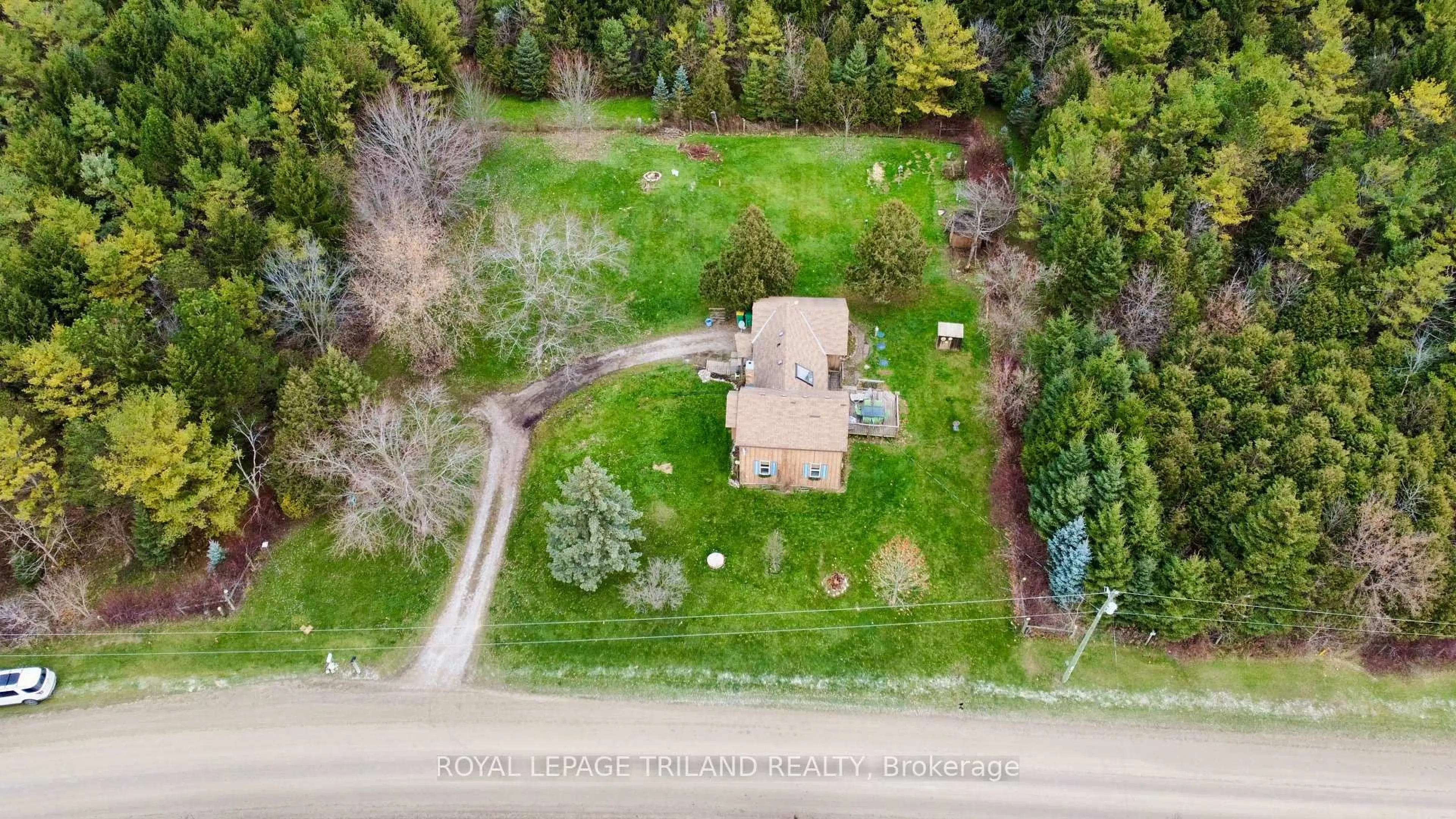 A pic from outside/outdoor area/front of a property/back of a property/a pic from drone, forest/trees view for 21622 Dundonald Rd, Southwest Middlesex Ontario N0L 1M0