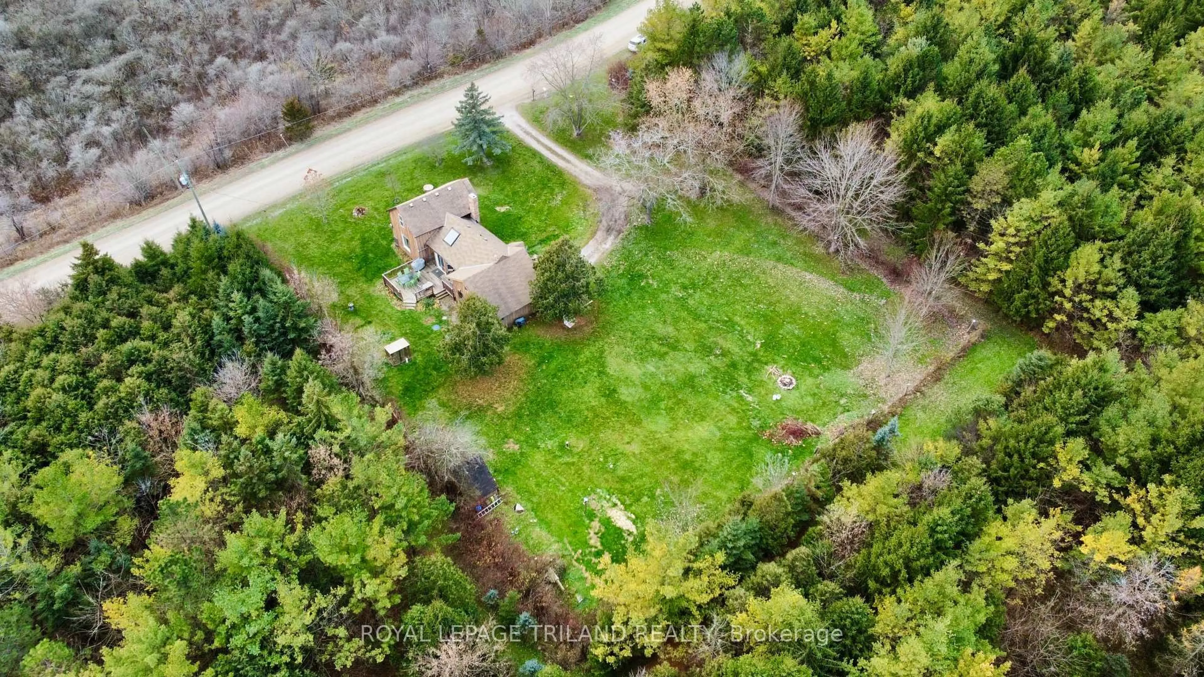 A pic from outside/outdoor area/front of a property/back of a property/a pic from drone, street for 21622 Dundonald Rd, Southwest Middlesex Ontario N0L 1M0