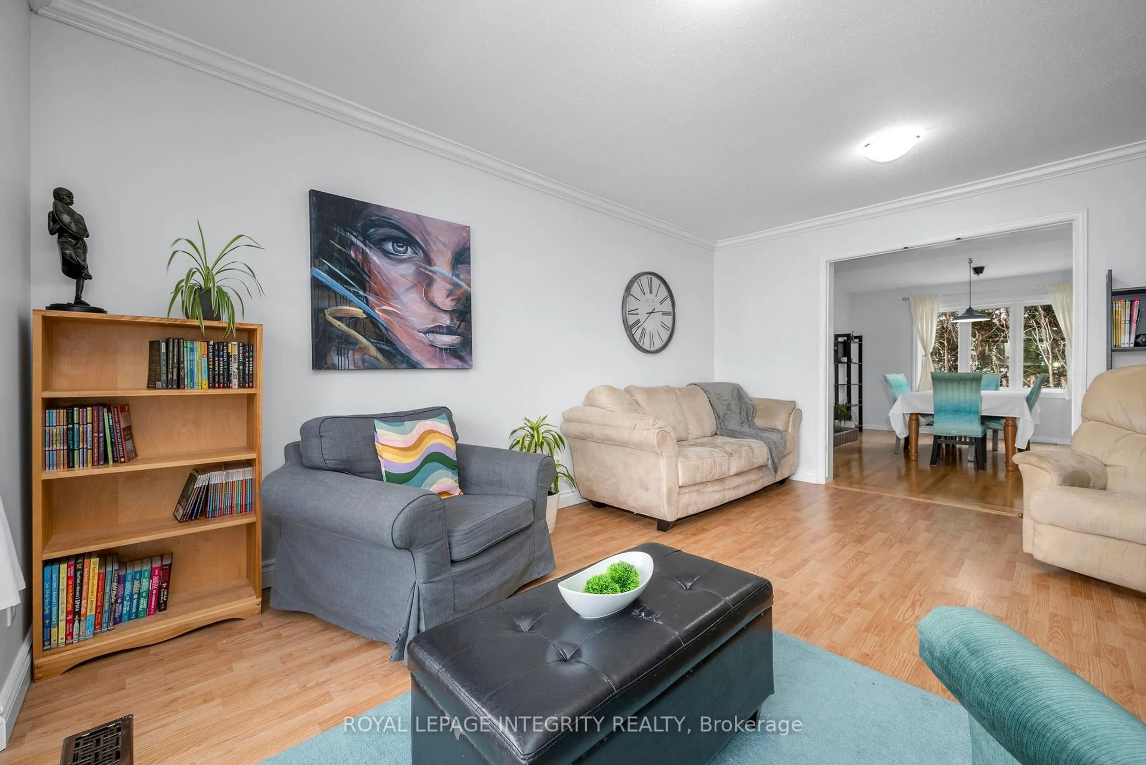 Living room with furniture, wood/laminate floor for 268 McEachern Cres, Ottawa Ontario K1E 3K5