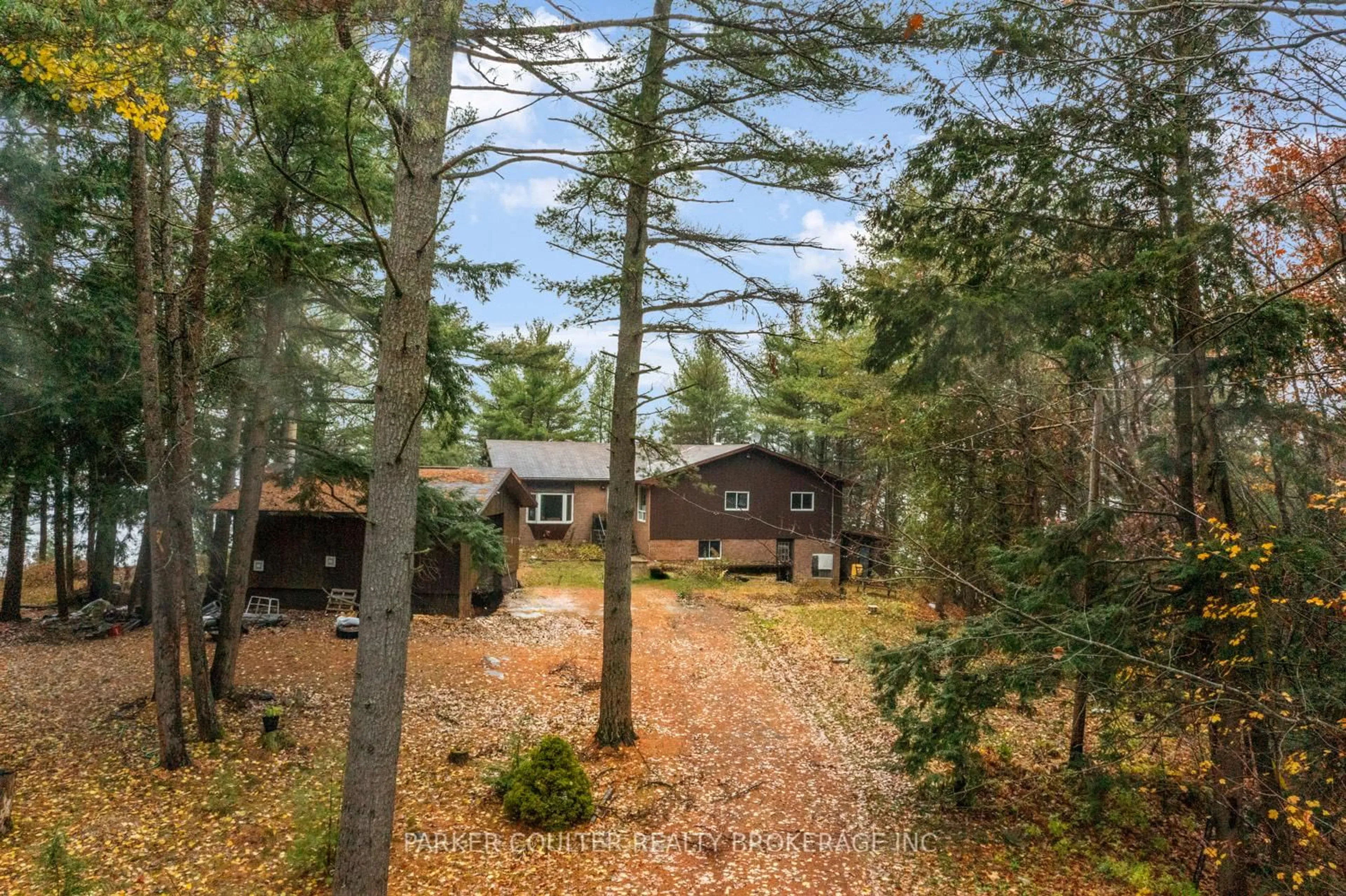 A pic from outside/outdoor area/front of a property/back of a property/a pic from drone, forest/trees view for 1191 Geewadin Rd, Parry Sound Ontario P2A 1B9