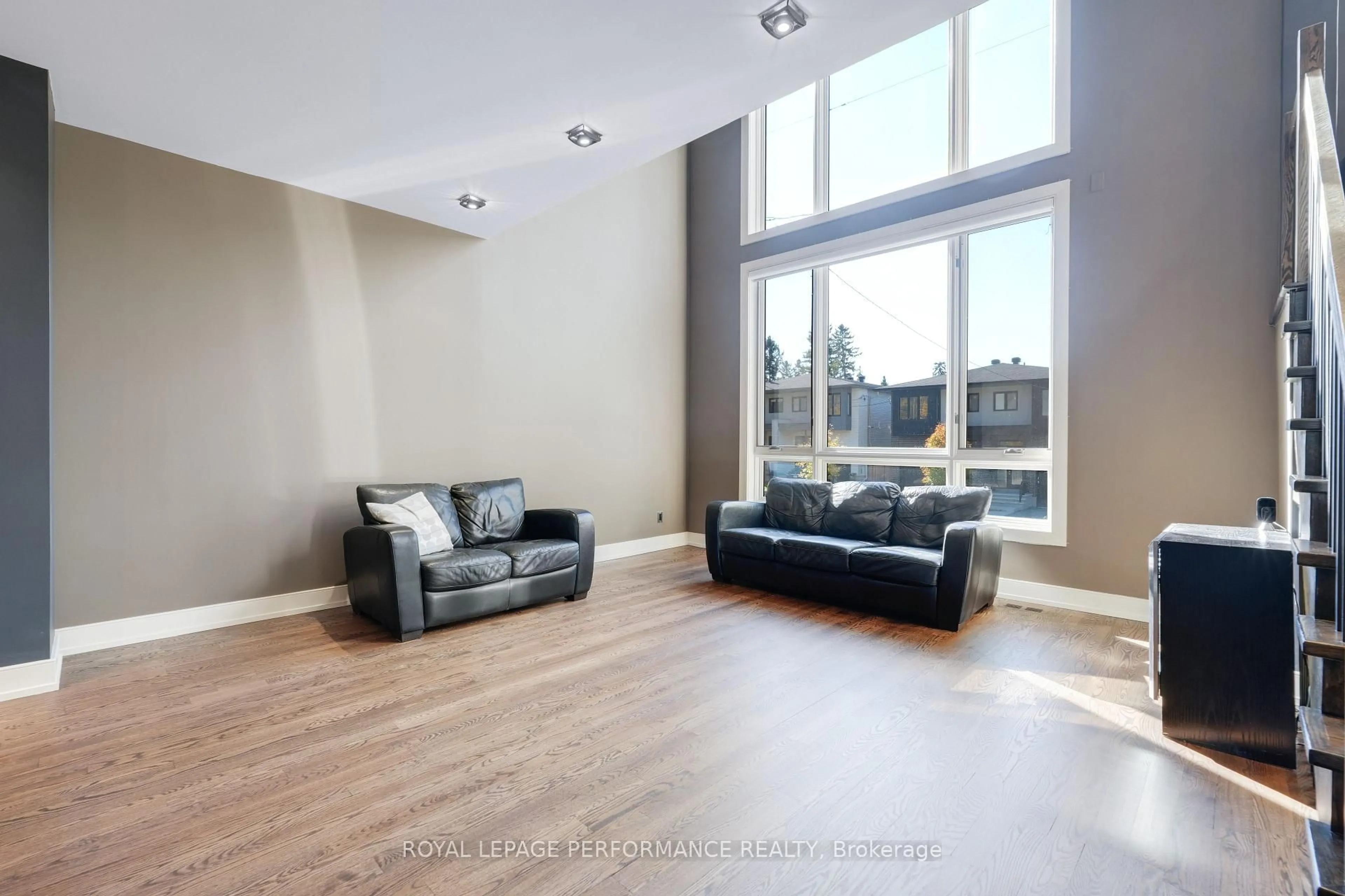 Living room with furniture, wood/laminate floor for 805 Kingsmere Ave, Ottawa Ontario K2A 3J8