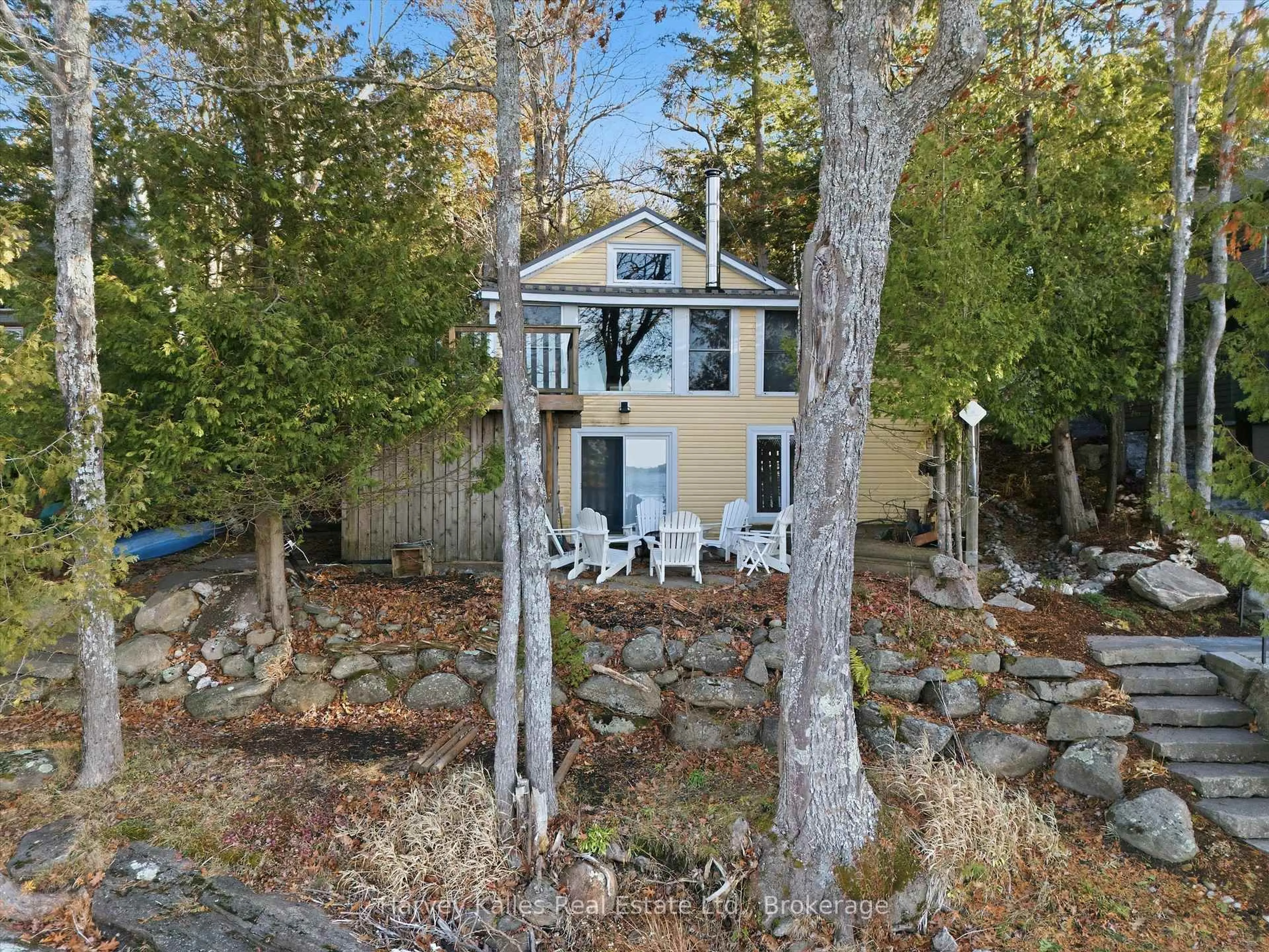 A pic from outside/outdoor area/front of a property/back of a property/a pic from drone, water/lake/river/ocean view for 1020 Ennis Bay Rd, Bracebridge Ontario P1P 1R1