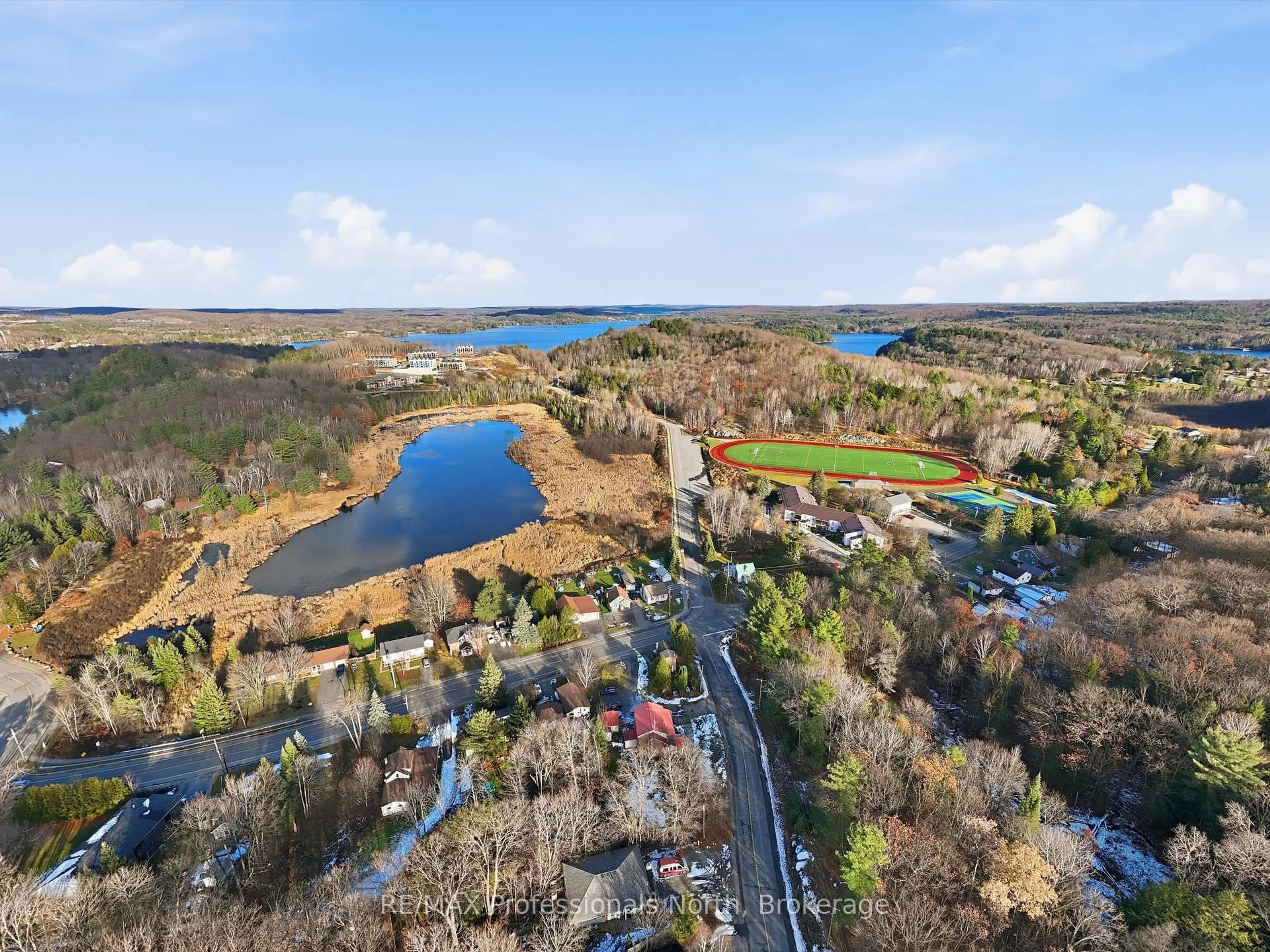 A pic from outside/outdoor area/front of a property/back of a property/a pic from drone, water/lake/river/ocean view for 107 Brunel Rd, Huntsville Ontario P1H 1R1