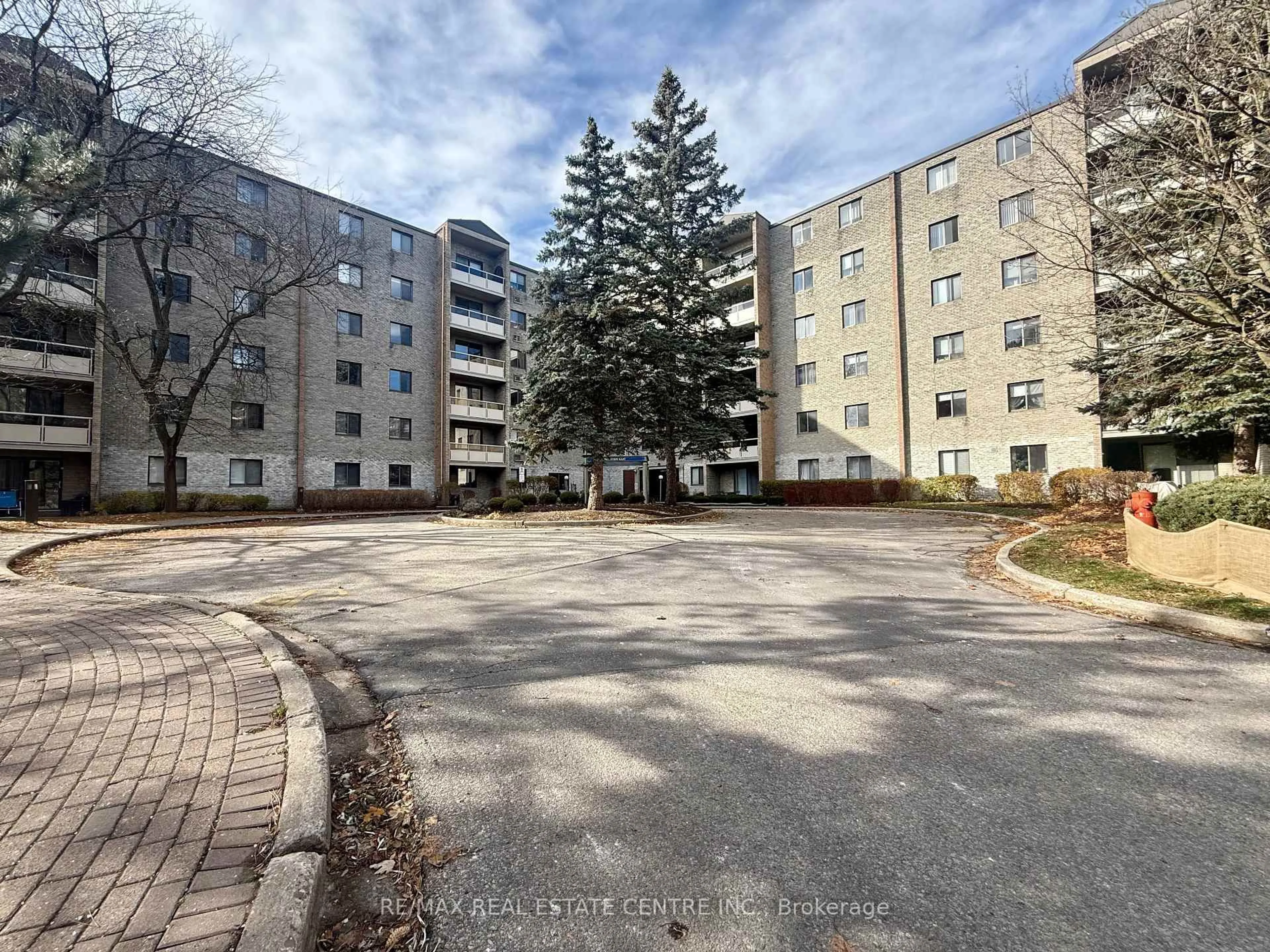 A pic from outside/outdoor area/front of a property/back of a property/a pic from drone, street for 89 Westwood Rd #209, Guelph Ontario N1H 7J6