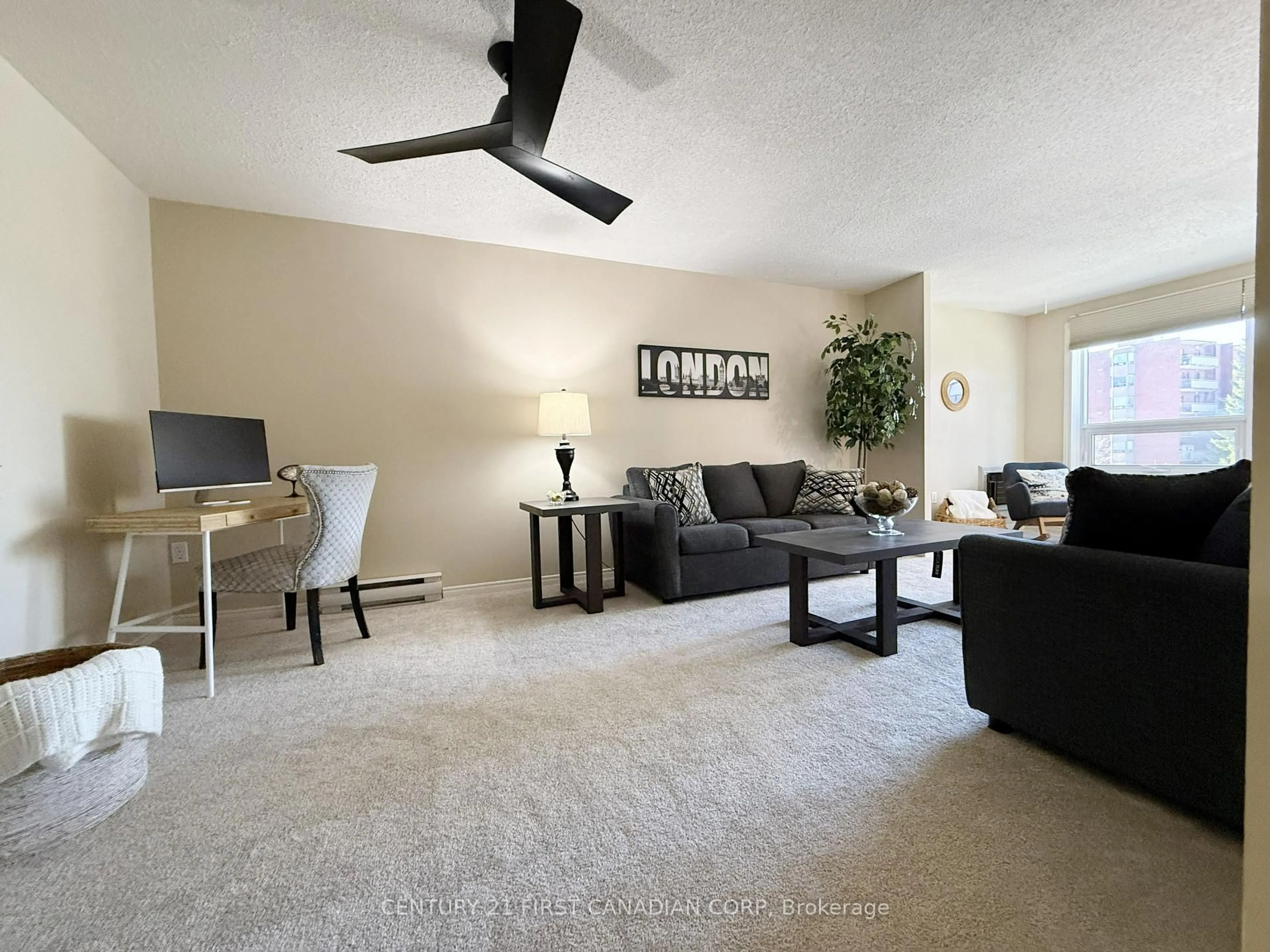 Living room with furniture, carpet floor for 95 Baseline Rd #309, London South Ontario N6J 4X3