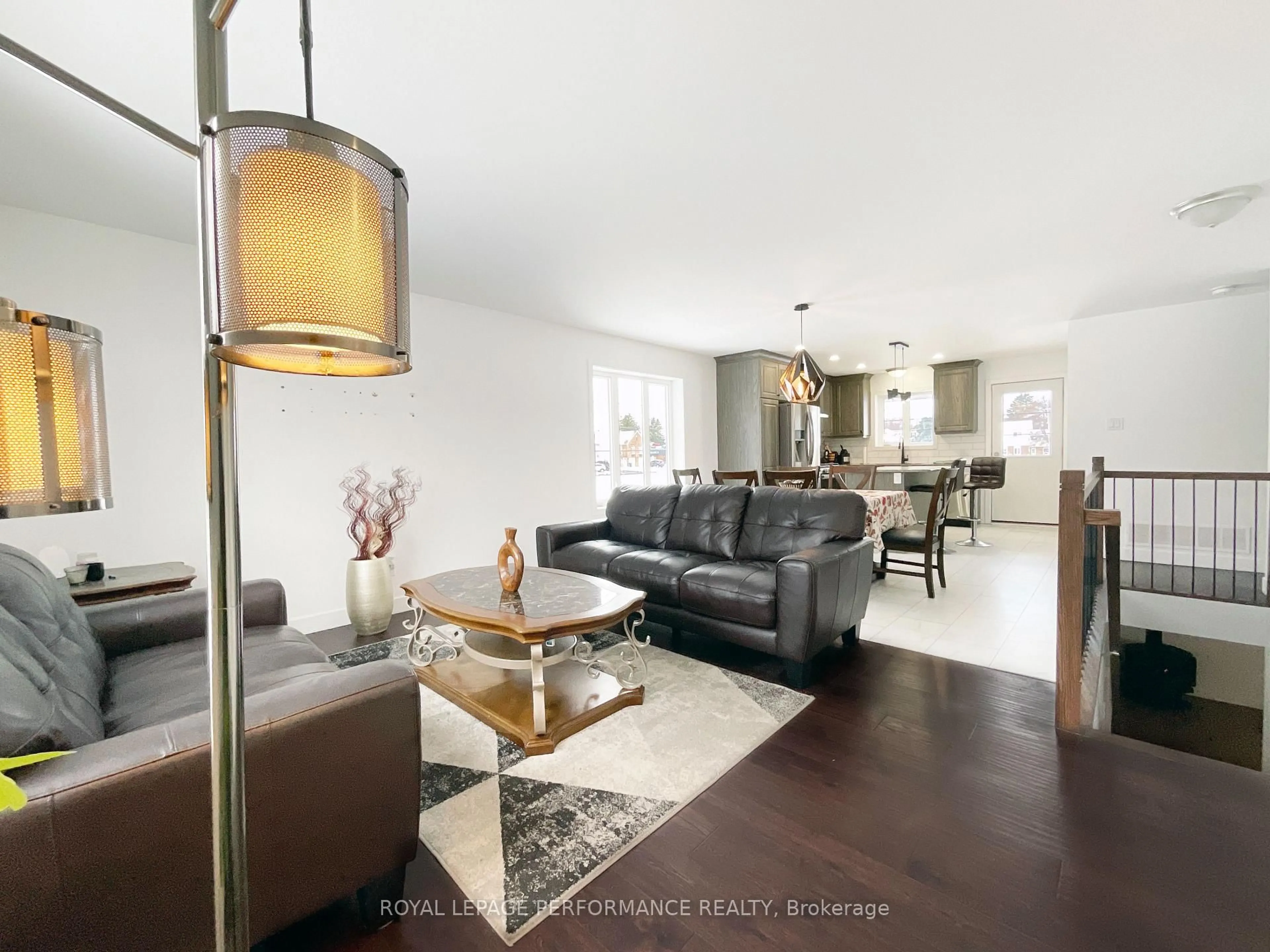 Living room with furniture, wood/laminate floor for 830 Portelance Ave, Hawkesbury Ontario K6A 2Z4