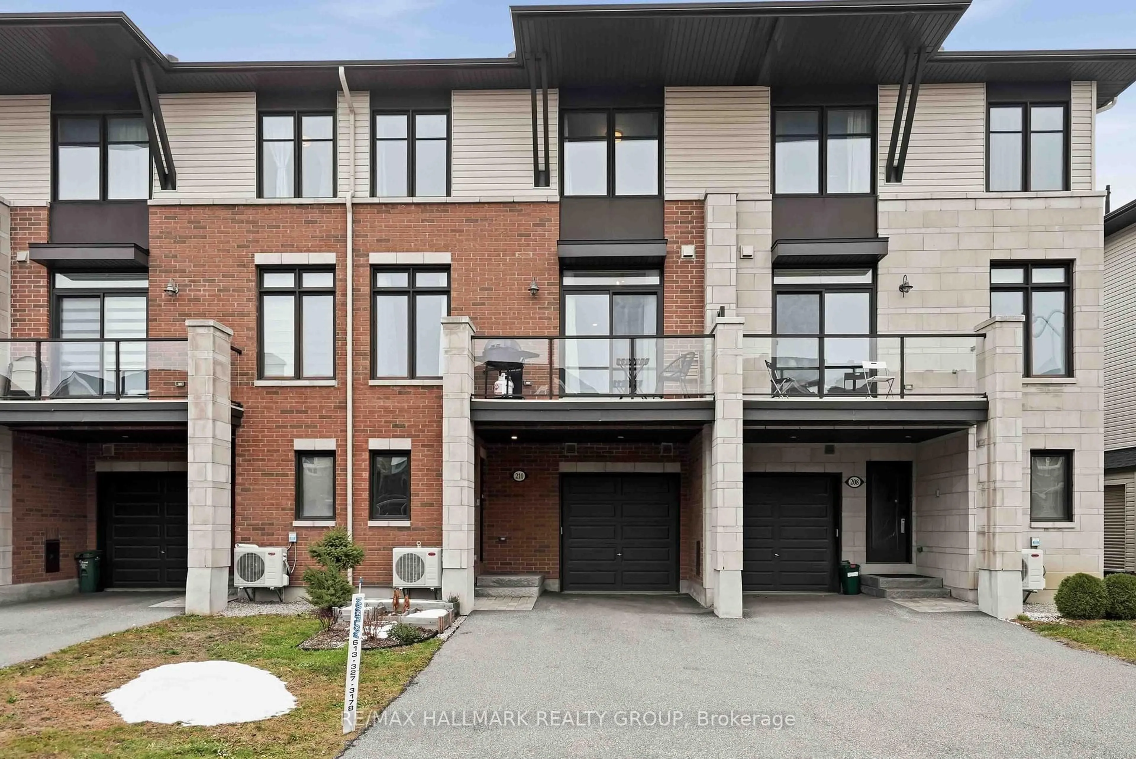 Home with brick exterior material, street for 210 Hawkmere Way, Ottawa Ontario K1T 0R5