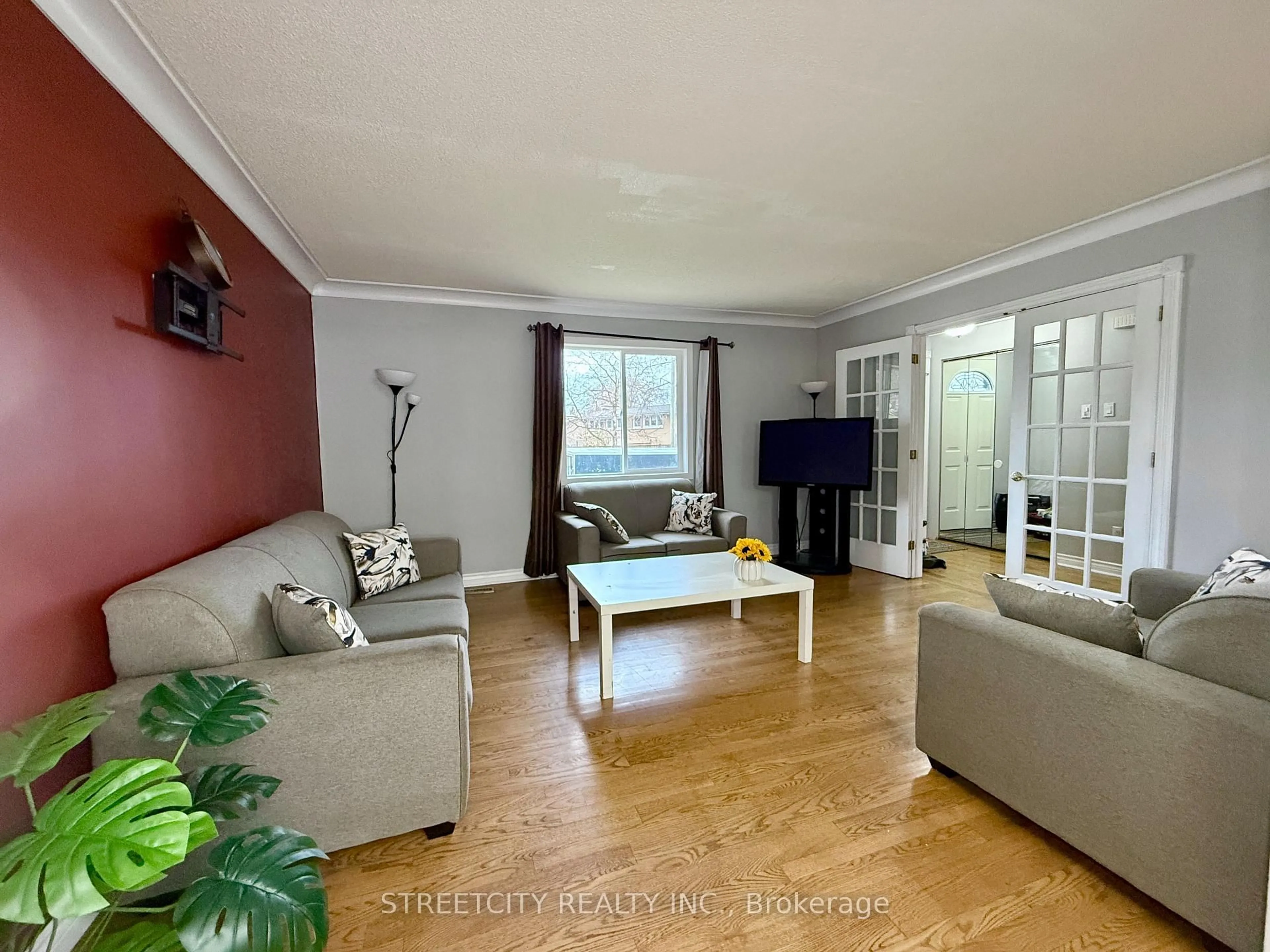 Living room with furniture, wood/laminate floor for 1508 Len Ave, Sarnia Ontario N7S 3N1