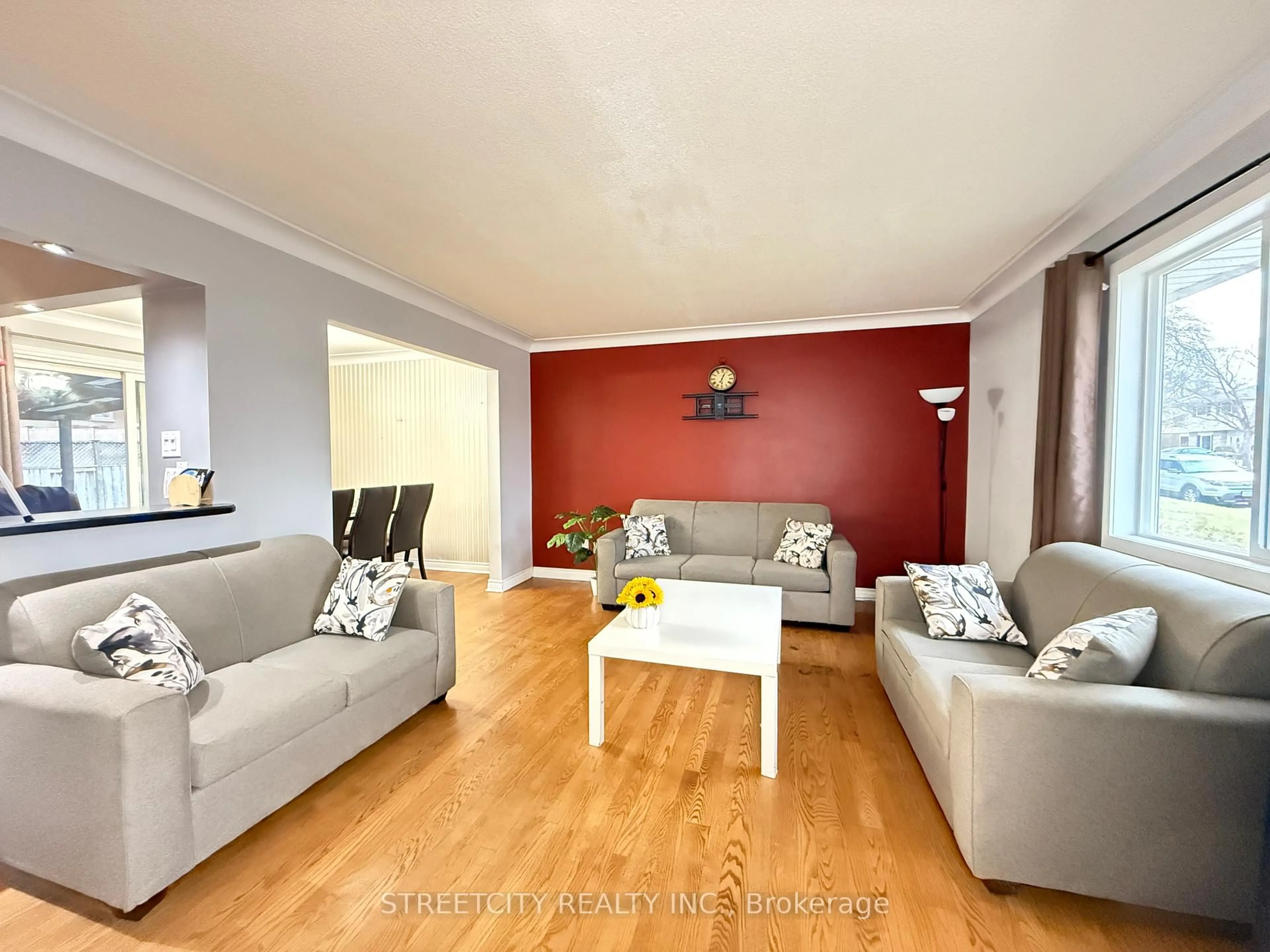 Living room with furniture, wood/laminate floor for 1508 Len Ave, Sarnia Ontario N7S 3N1