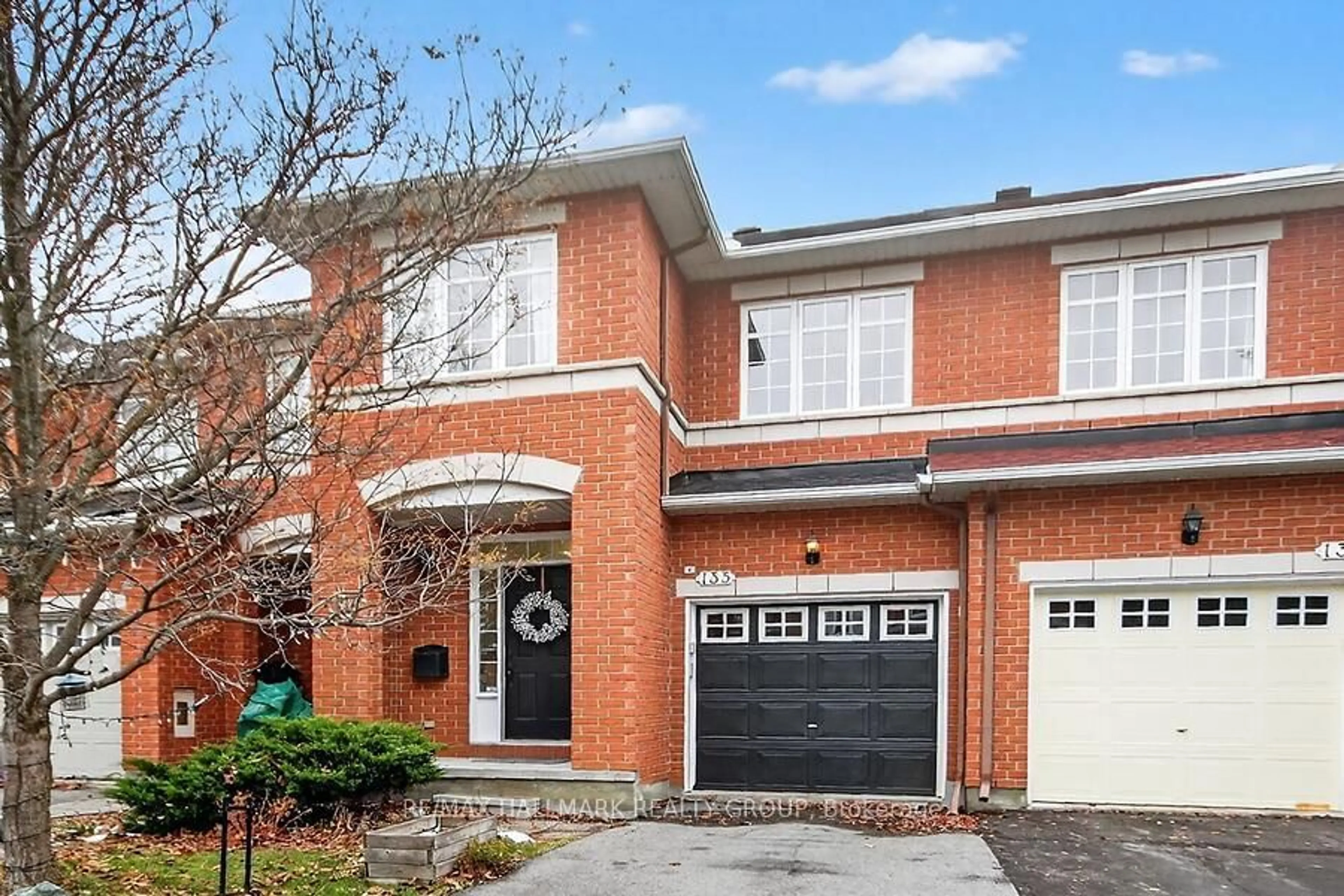 Home with brick exterior material, street for 135 Gatespark Private, Ottawa Ontario K2T 1L1