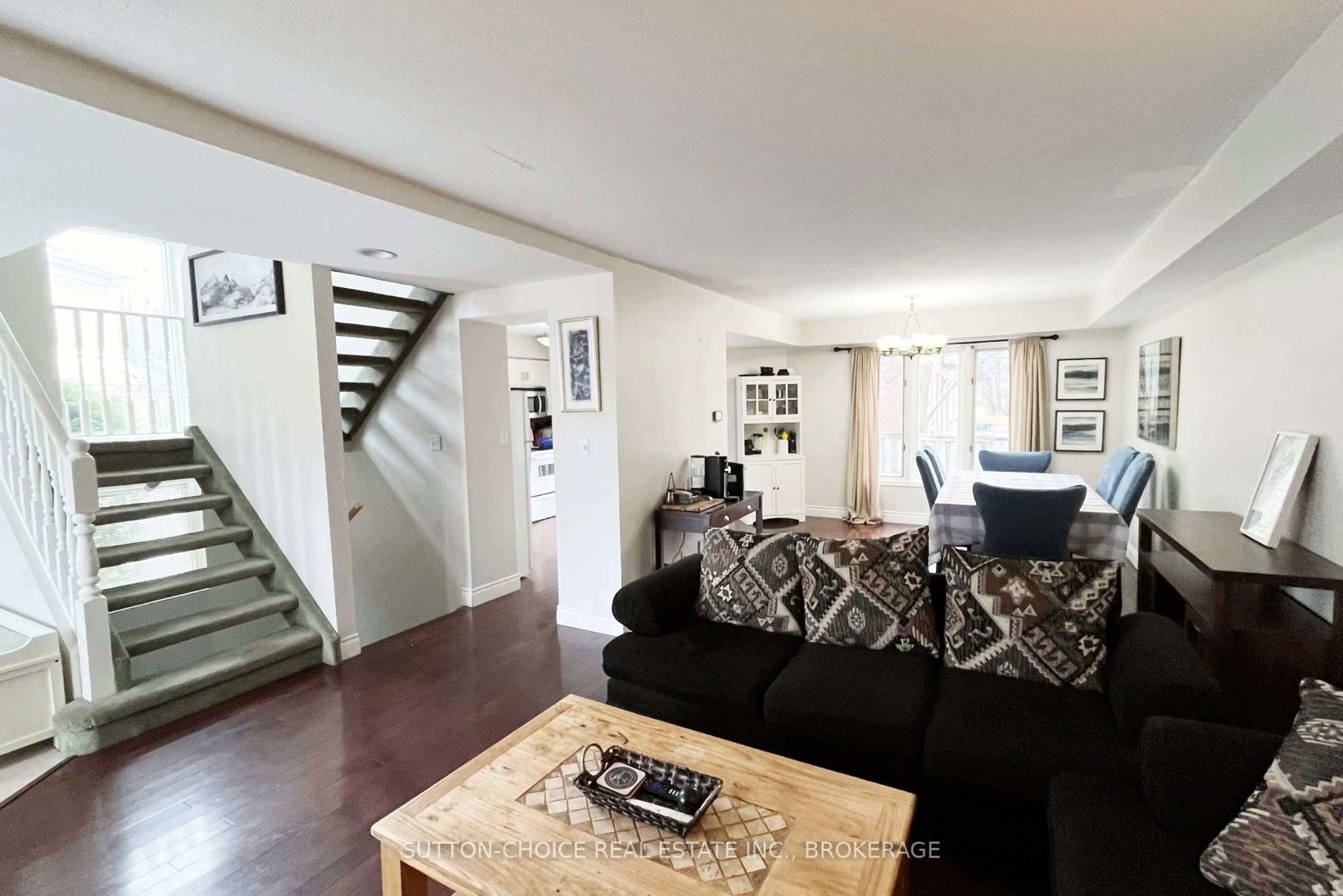 Living room with furniture, wood/laminate floor for 603 TACKABERRY Dr, North Bay Ontario P1B 9L2