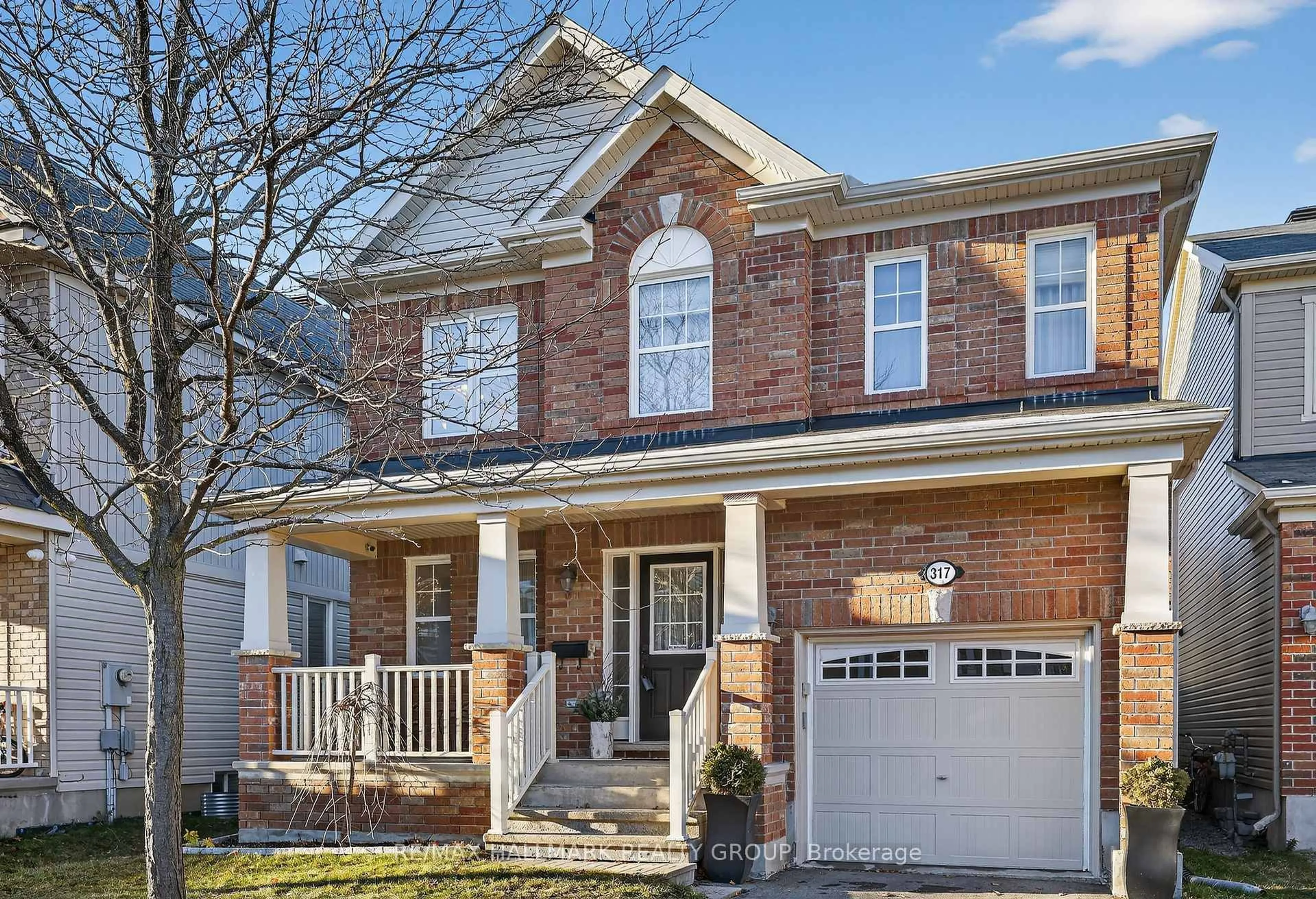 Home with brick exterior material, street for 317 River Landing Ave, Ottawa Ontario K2J 3V4