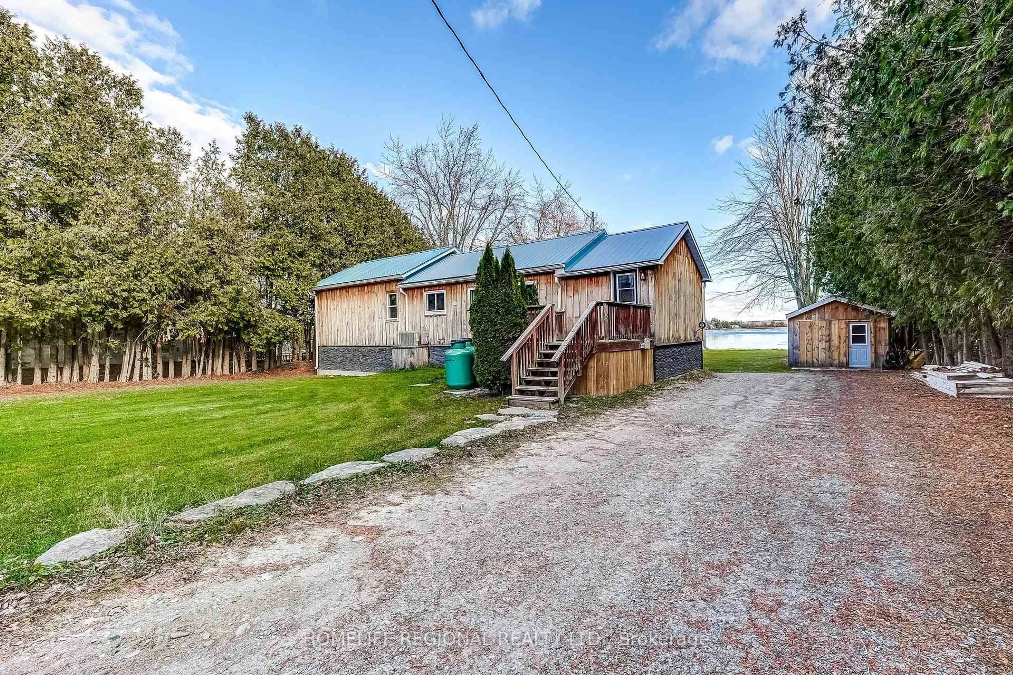 A pic from outside/outdoor area/front of a property/back of a property/a pic from drone, street for 130 Crawford Rd, Kawartha Lakes Ontario L0K 1B0
