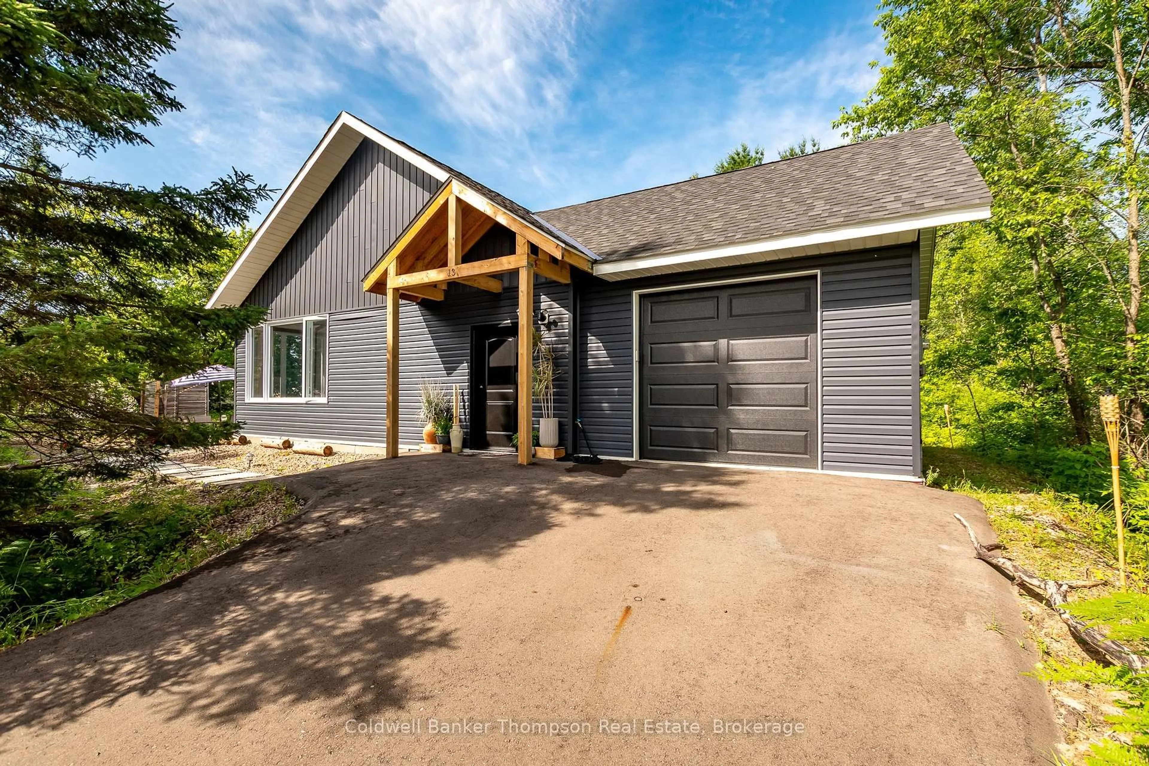 Home with vinyl exterior material, street for 13 Lewis St, South River Ontario P0A 1X0