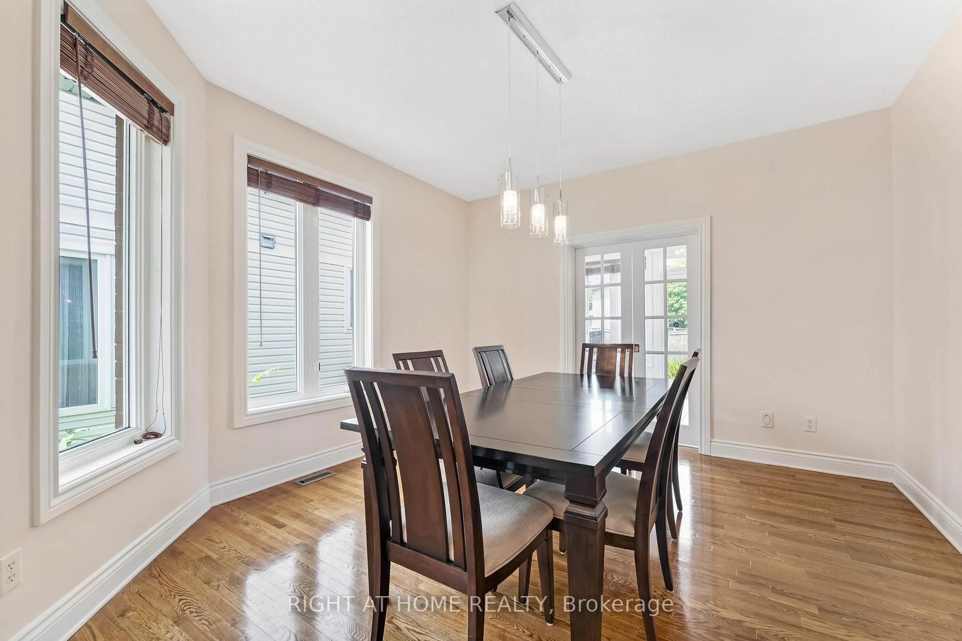 Dining room, wood/laminate floor for 409 Beatrice Dr, Ottawa Ontario K2J 4W9