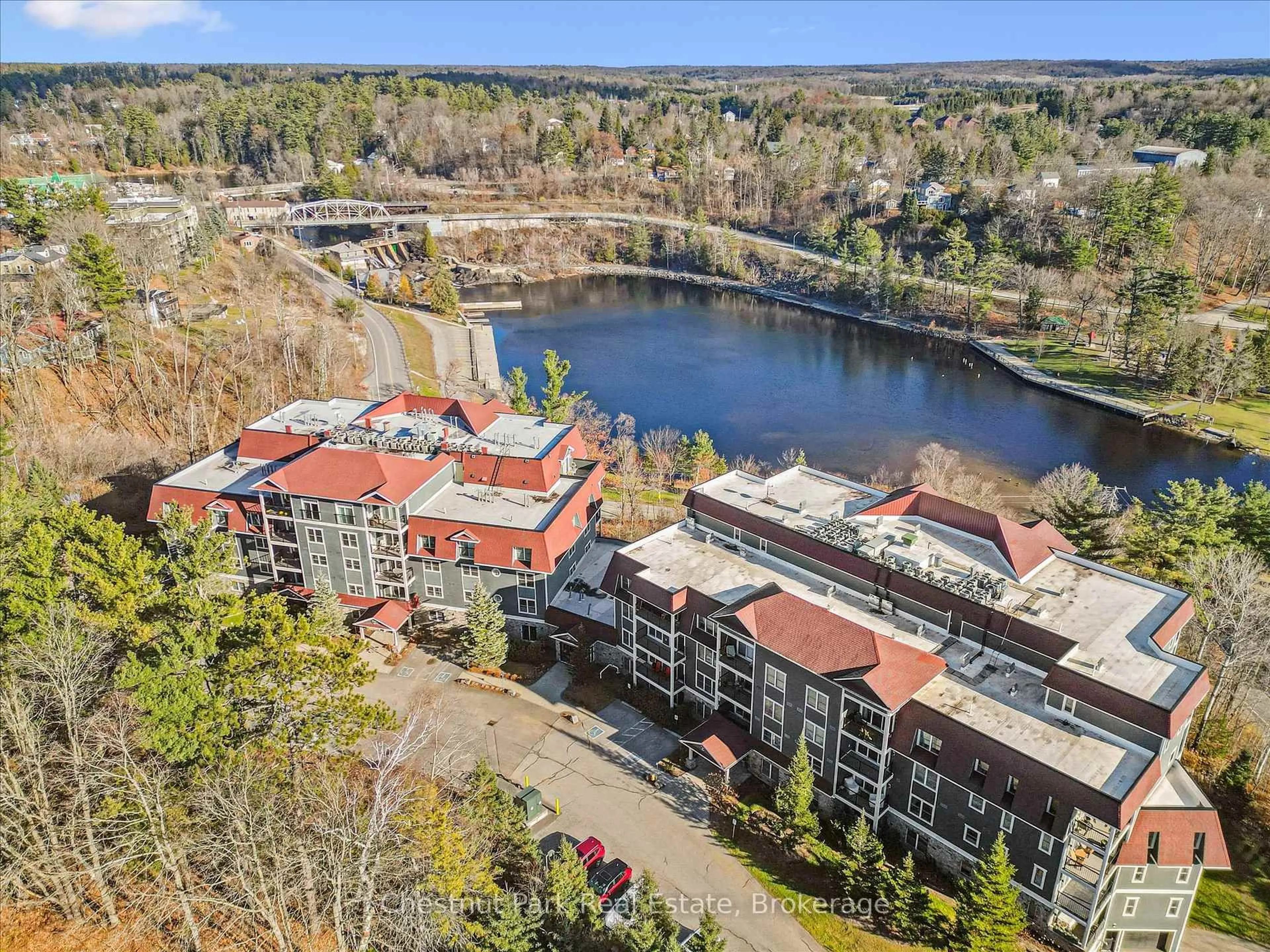 A pic from outside/outdoor area/front of a property/back of a property/a pic from drone, water/lake/river/ocean view for 10B Kimberley Ave #209, Bracebridge Ontario P1L 0A6
