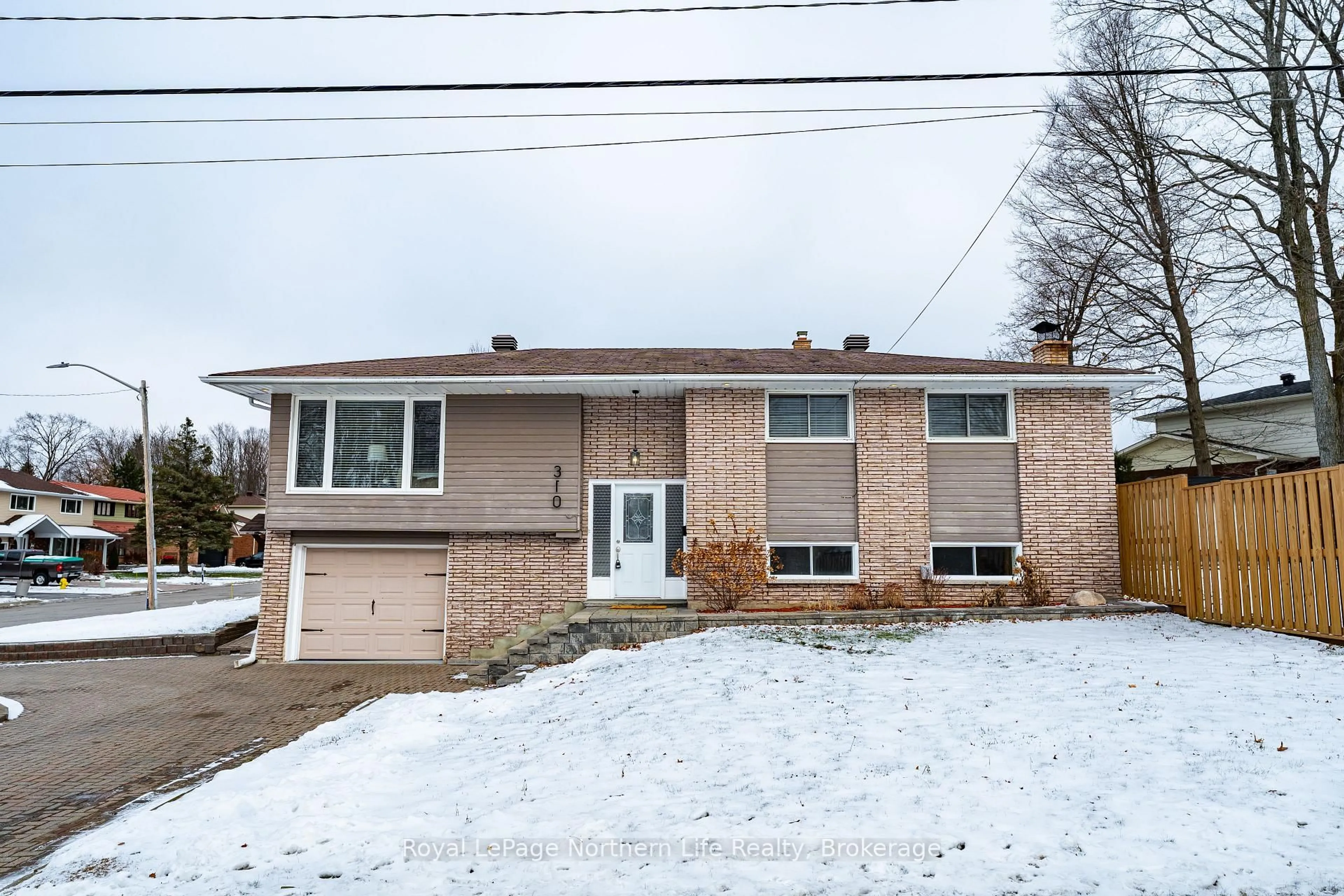 Home with brick exterior material, street for 310 Surrey Dr, North Bay Ontario P1C 1E3