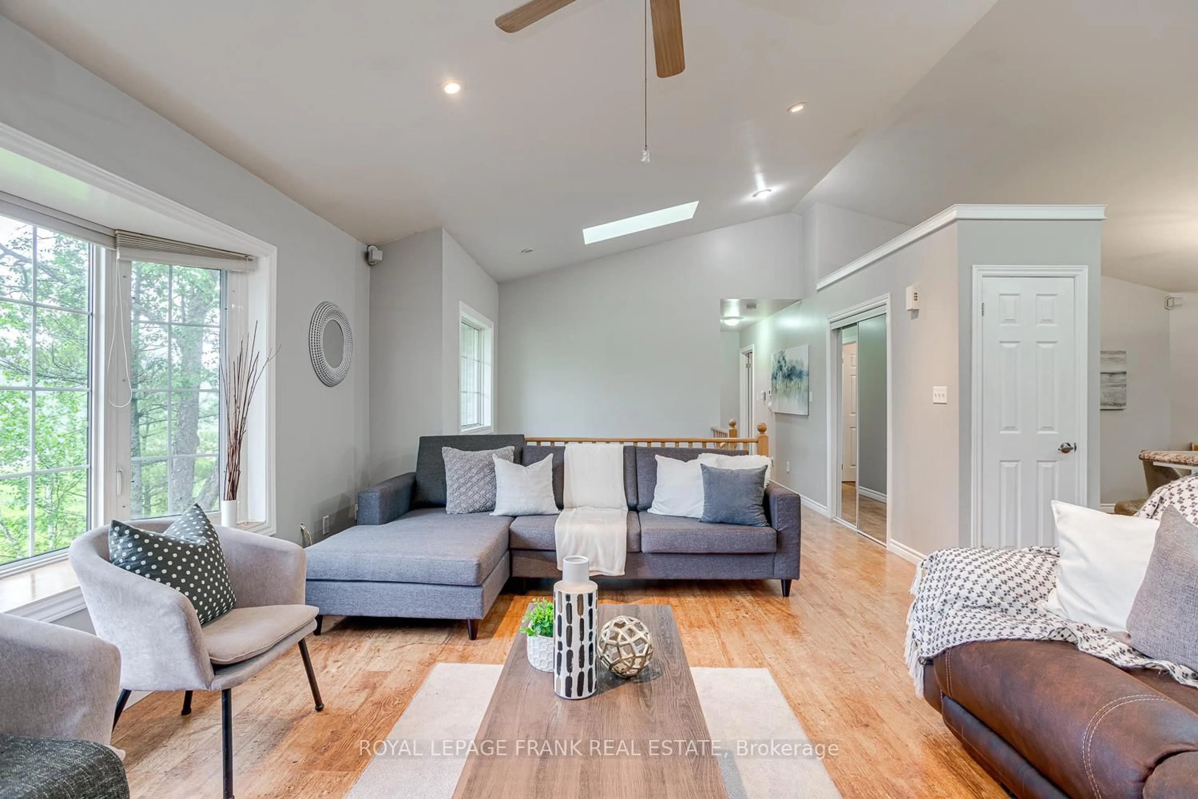 Living room with furniture, wood/laminate floor for 10913 County 9 Rd, Alnwick/Haldimand Ontario K0K 2X0