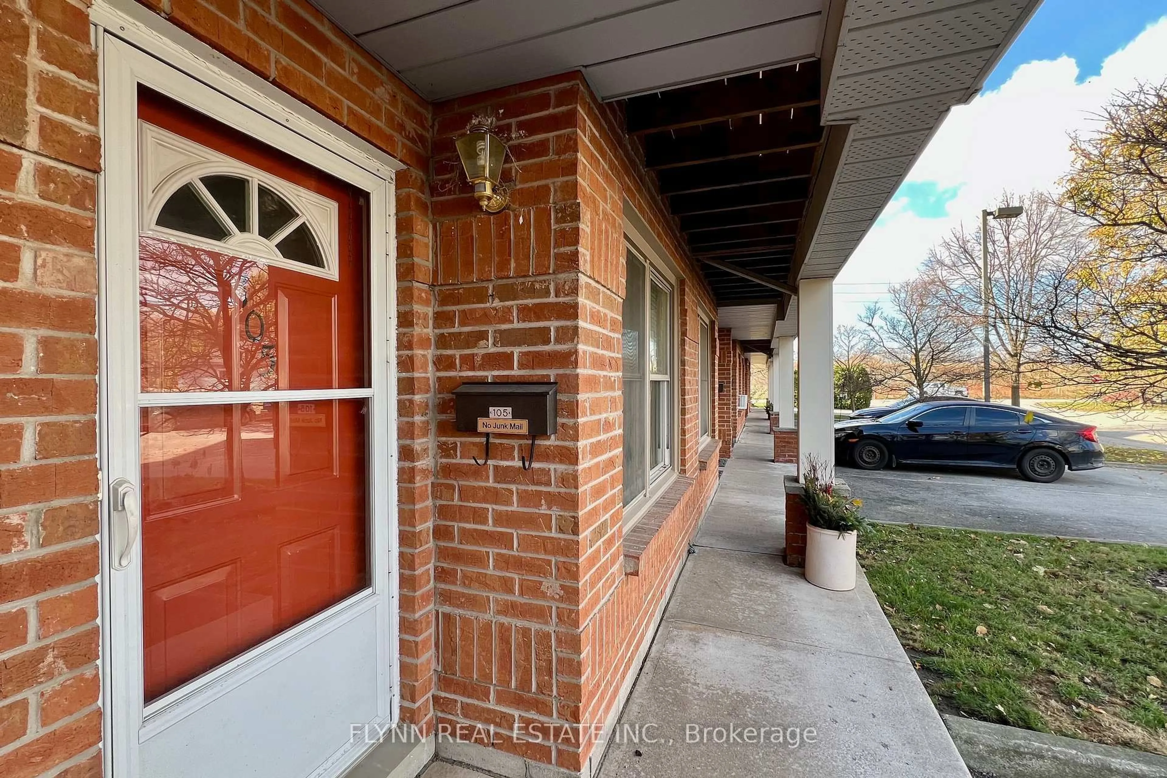 Home with brick exterior material, street for 2 Walnut St #105, St. Catharines Ontario L2T 1H3