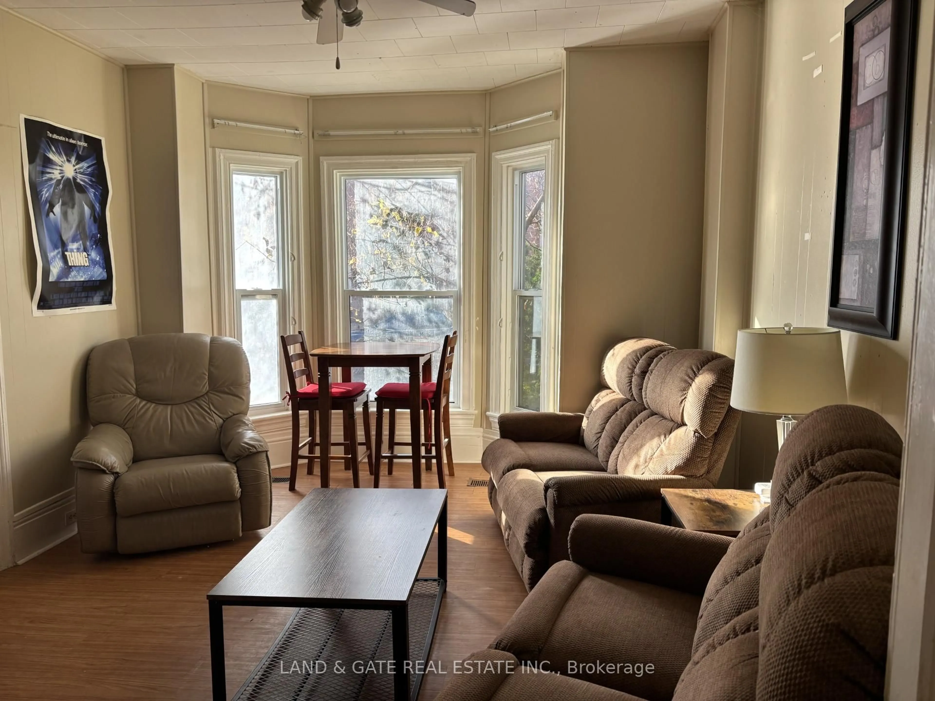 Living room with furniture, wood/laminate floor for 75 Division St, Kingston Ontario K7L 3M1