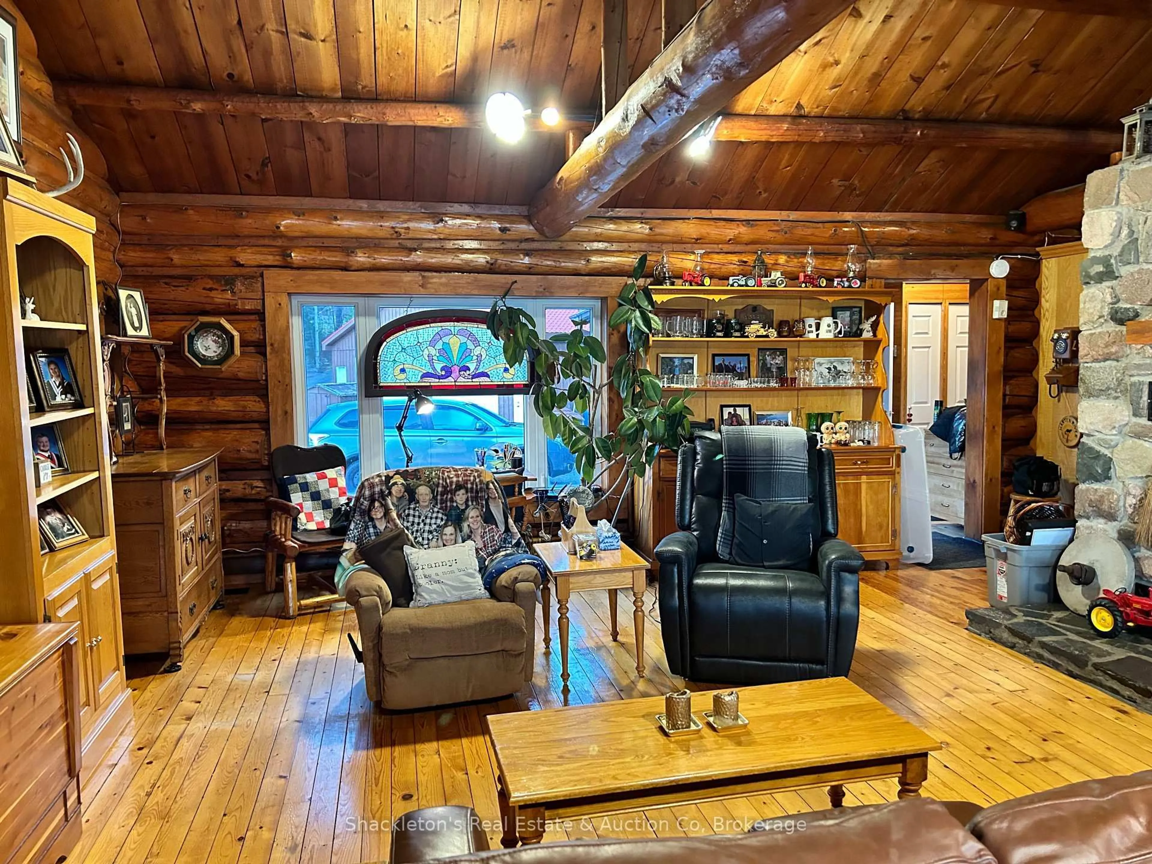 Living room with furniture, wood/laminate floor for 2407 Highway 11 Highway, Unorganized Townships Ontario P0H 1T0