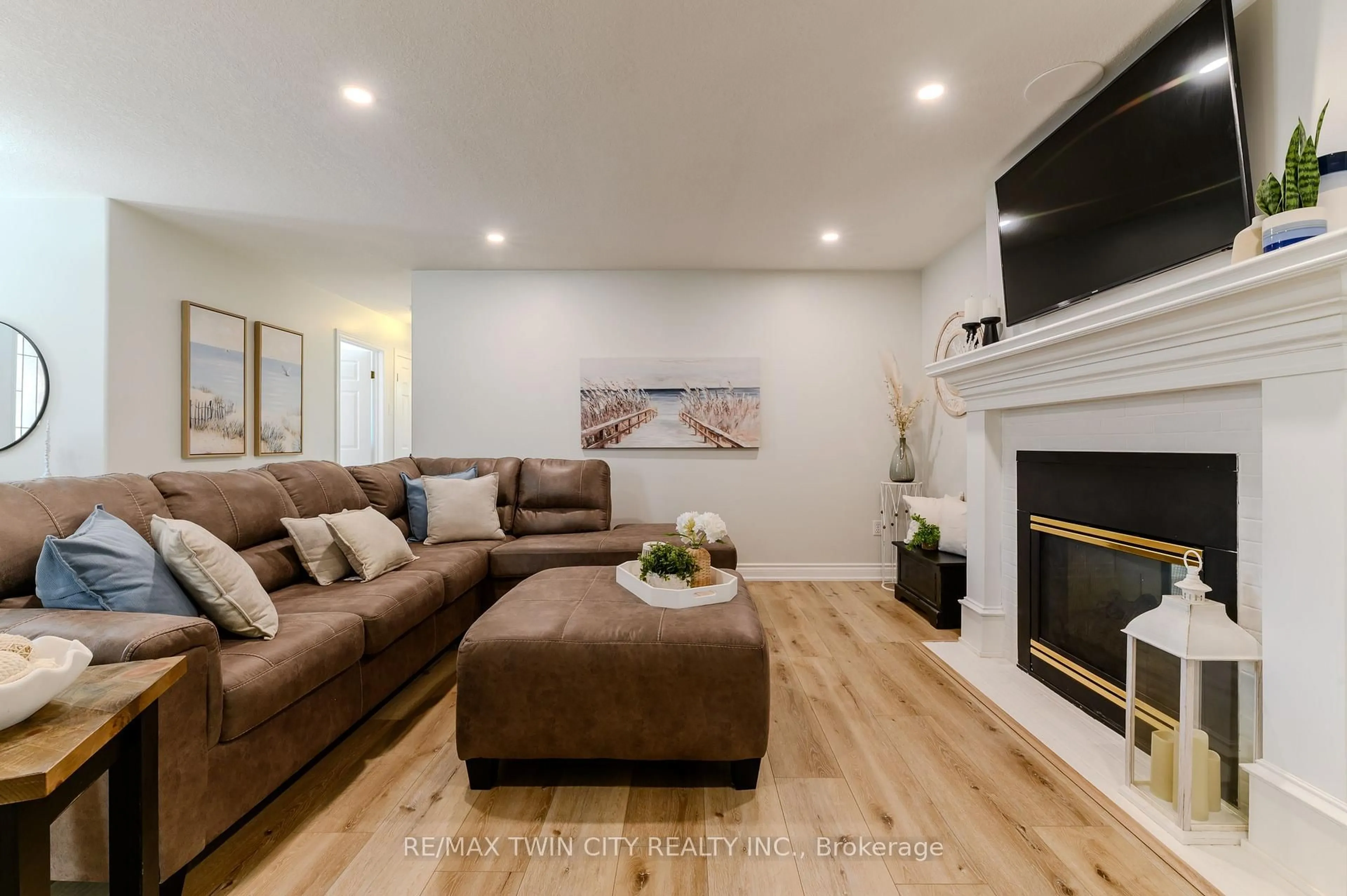 Living room with furniture, wood/laminate floor for 5 Newport Lane, Norfolk Ontario N0A 1N7