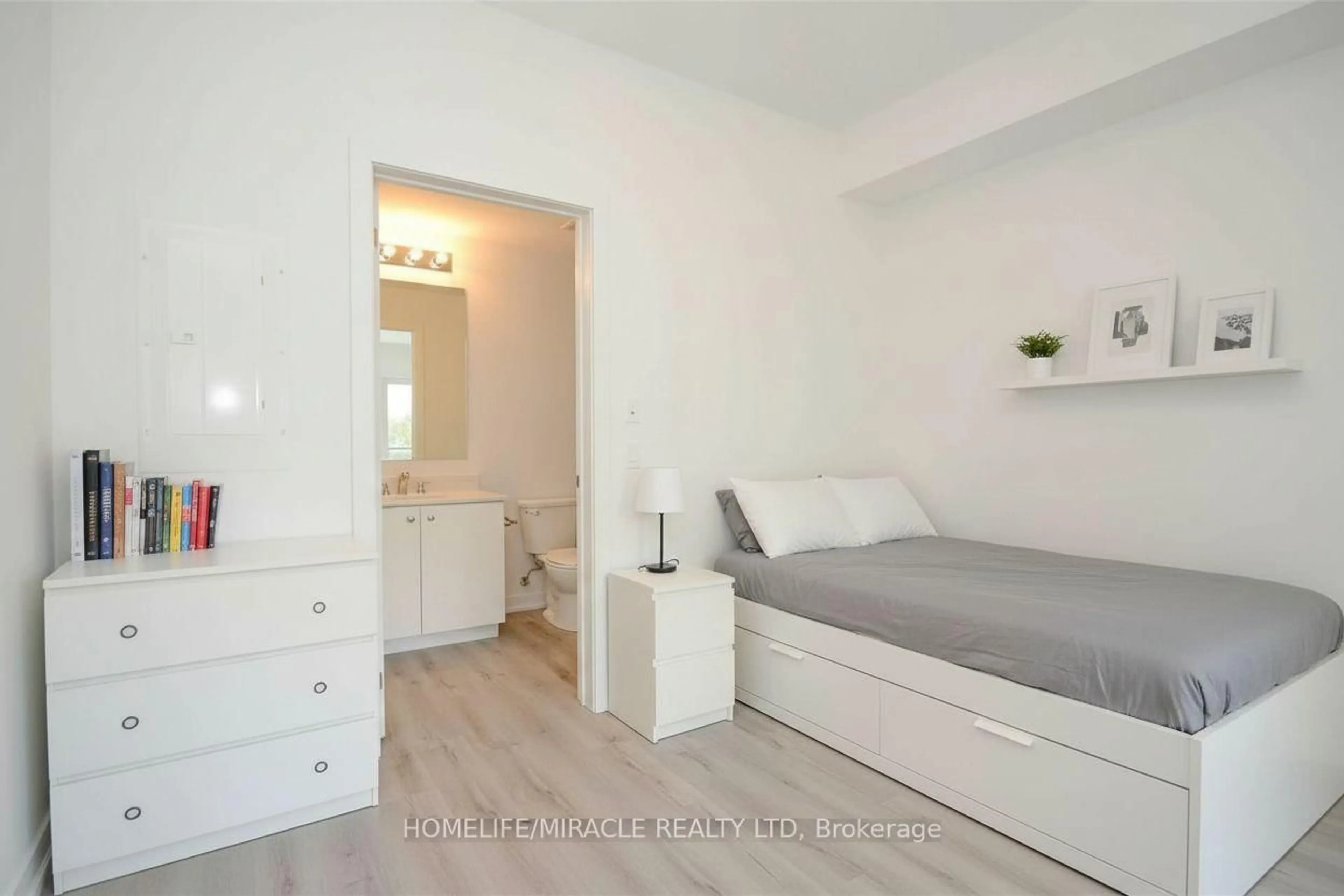 Bedroom with bed, wood/laminate floor for 243 Northfield Dr #211, Waterloo Ontario N2K 0G9