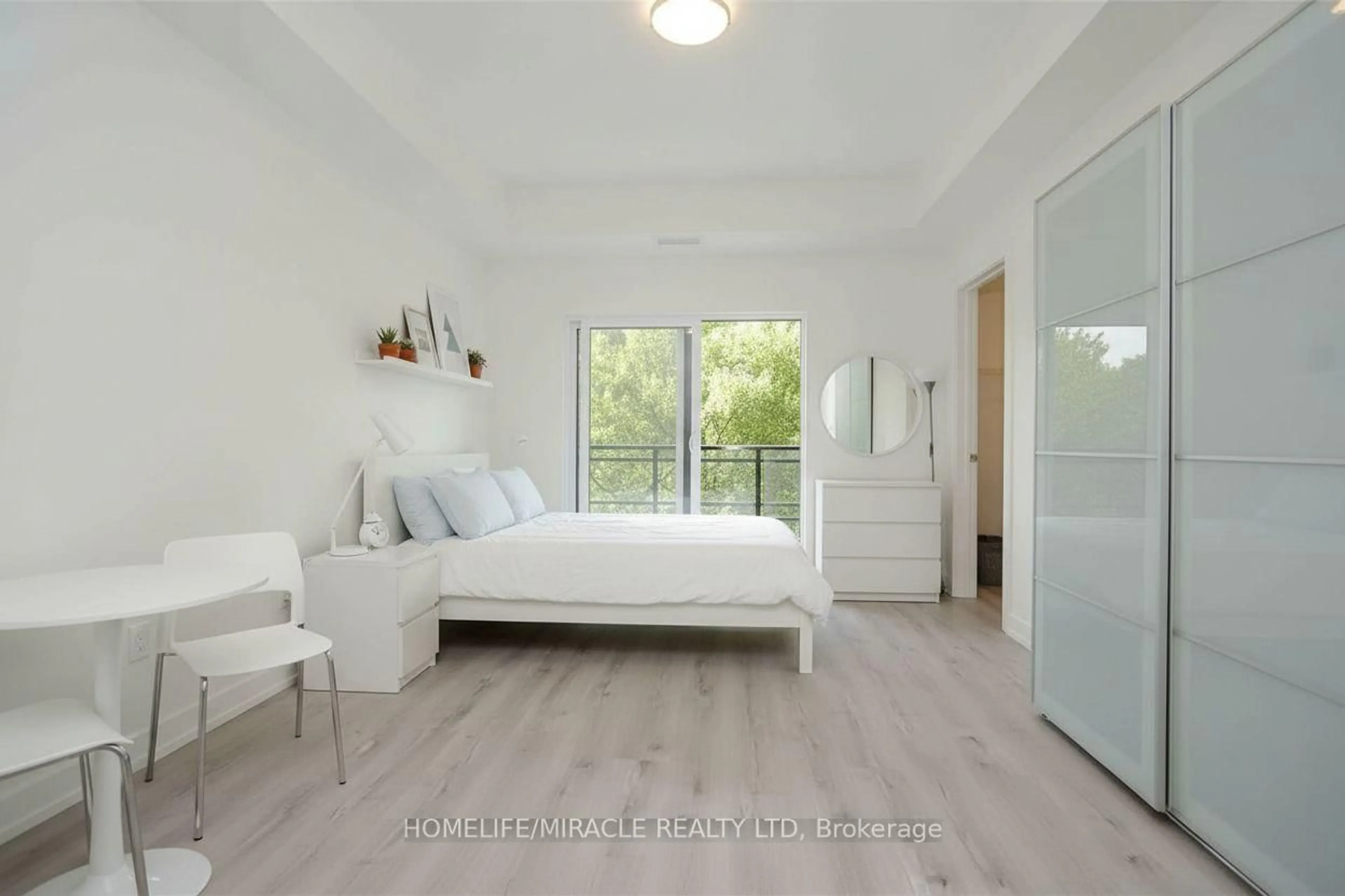 Bedroom with bed, wood/laminate floor for 243 Northfield Dr #211, Waterloo Ontario N2K 0G9