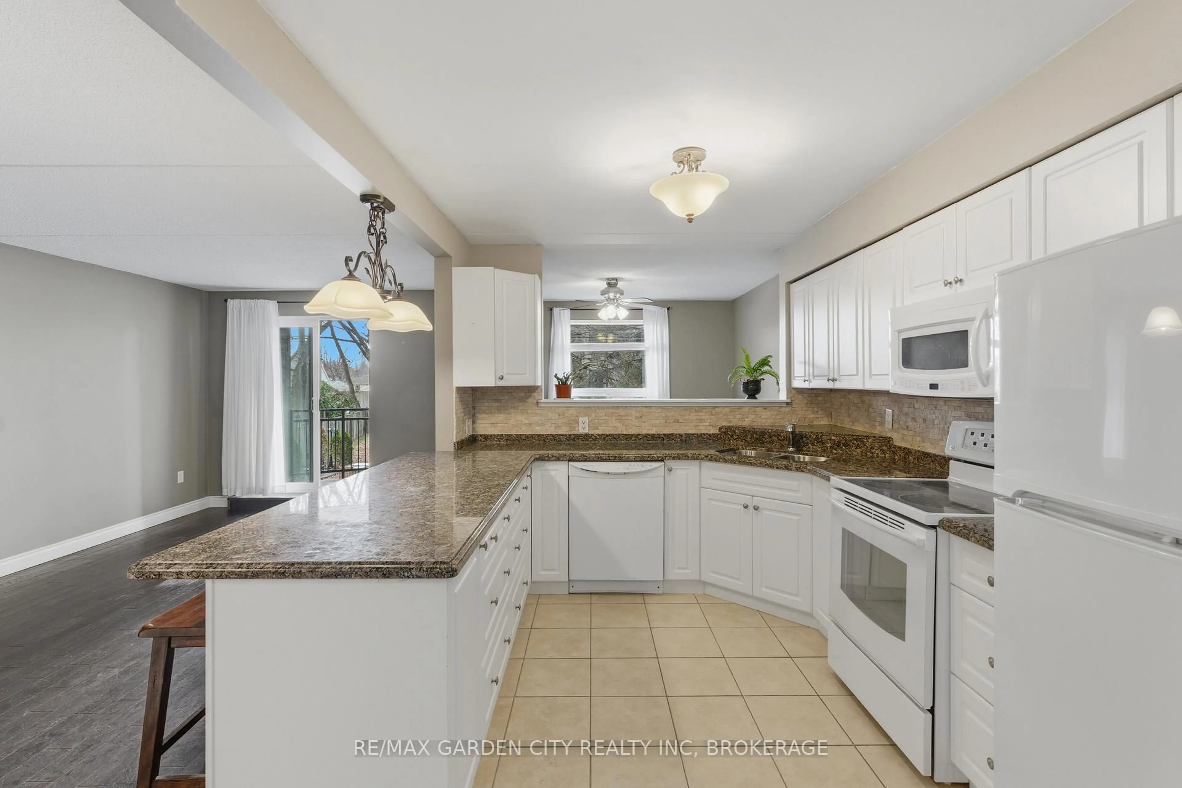 Open concept kitchen, ceramic/tile floor for 4658 Drummond Rd #230, Niagara Falls Ontario L2E 7E1