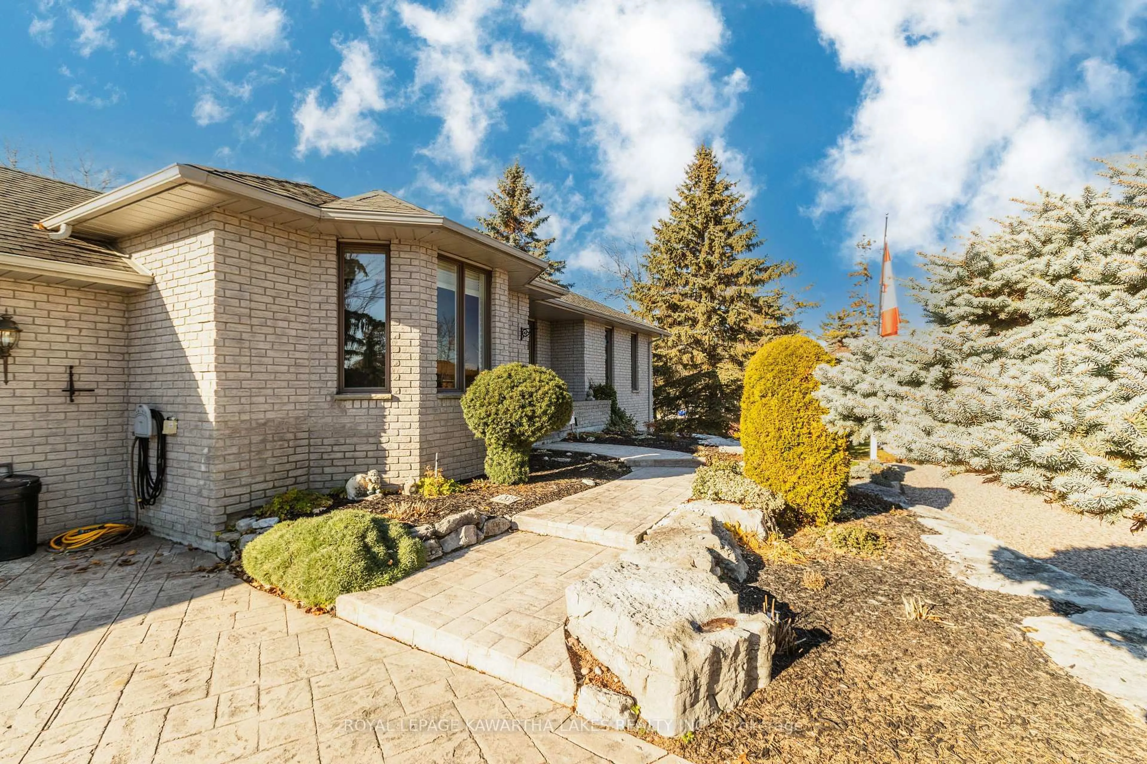 Home with brick exterior material, street for 83 Navigators Tr, Kawartha Lakes Ontario K0M 1A0
