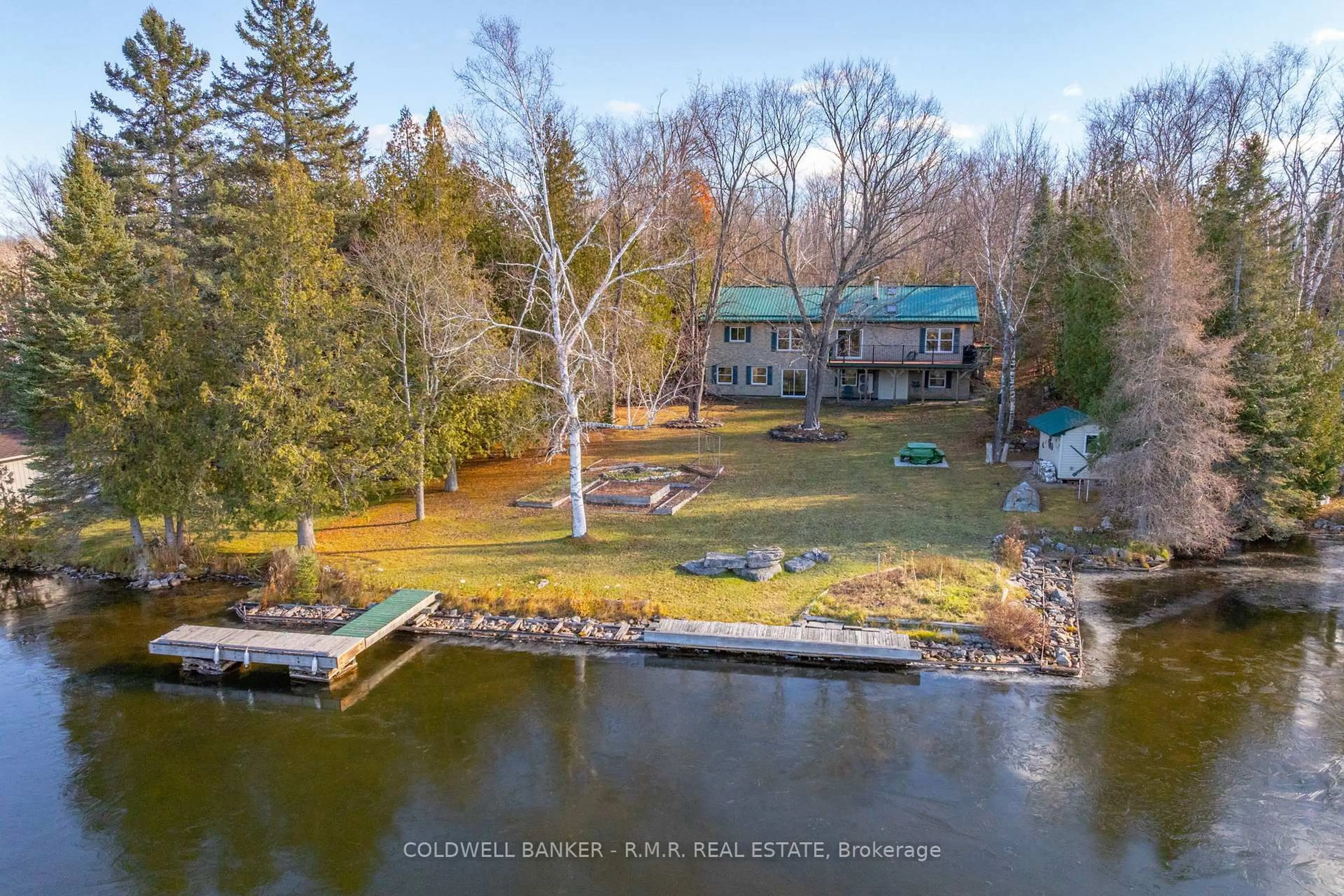 A pic from outside/outdoor area/front of a property/back of a property/a pic from drone, water/lake/river/ocean view for 60 Everett Rd, Kawartha Lakes Ontario K0M 1K0