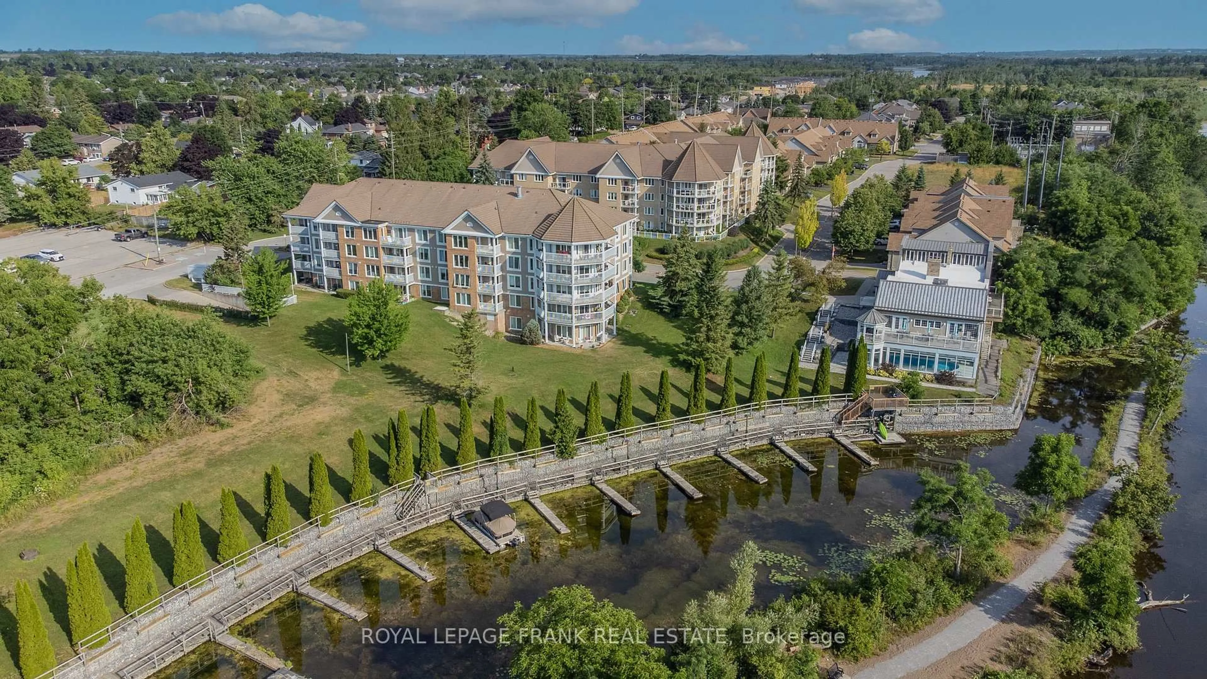 A pic from outside/outdoor area/front of a property/back of a property/a pic from drone, water/lake/river/ocean view for 50 Rivermill Blvd #308, Kawartha Lakes Ontario K9V 6C1