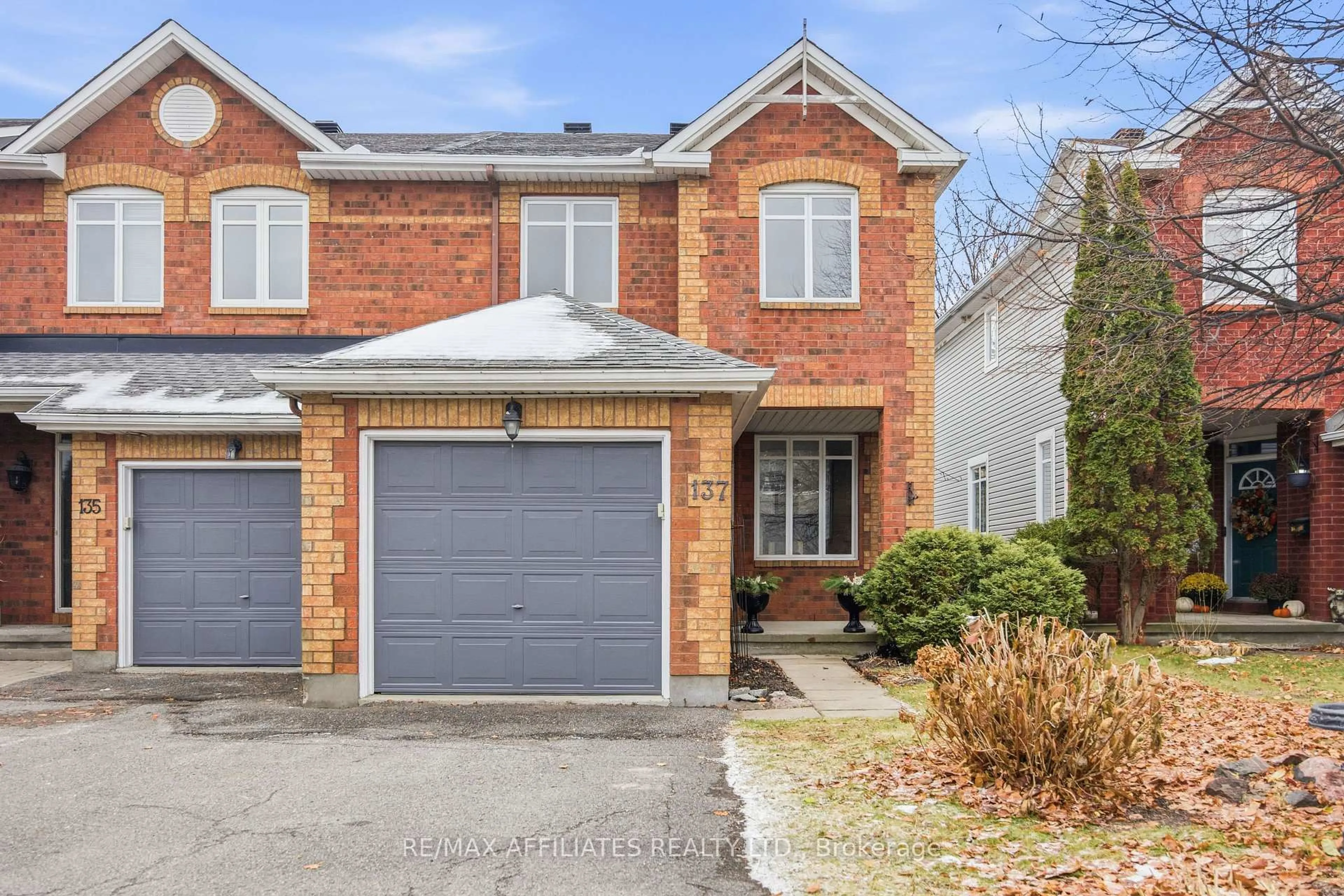 Home with brick exterior material, street for 137 Hearst Way, Ottawa Ontario K2L 4G5