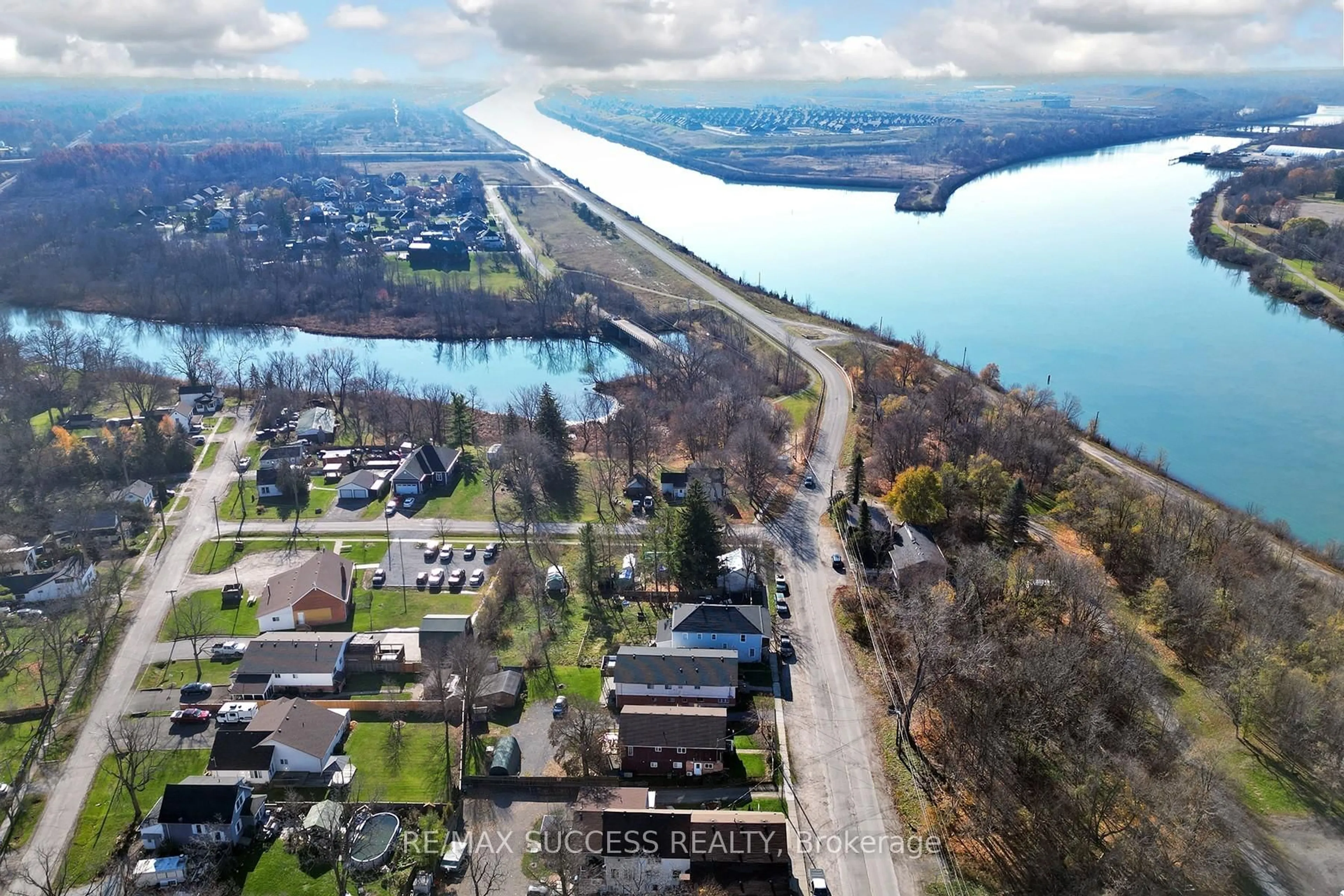 A pic from outside/outdoor area/front of a property/back of a property/a pic from drone, water/lake/river/ocean view for 32 & 34 River St, Thorold Ontario L0S 1K0