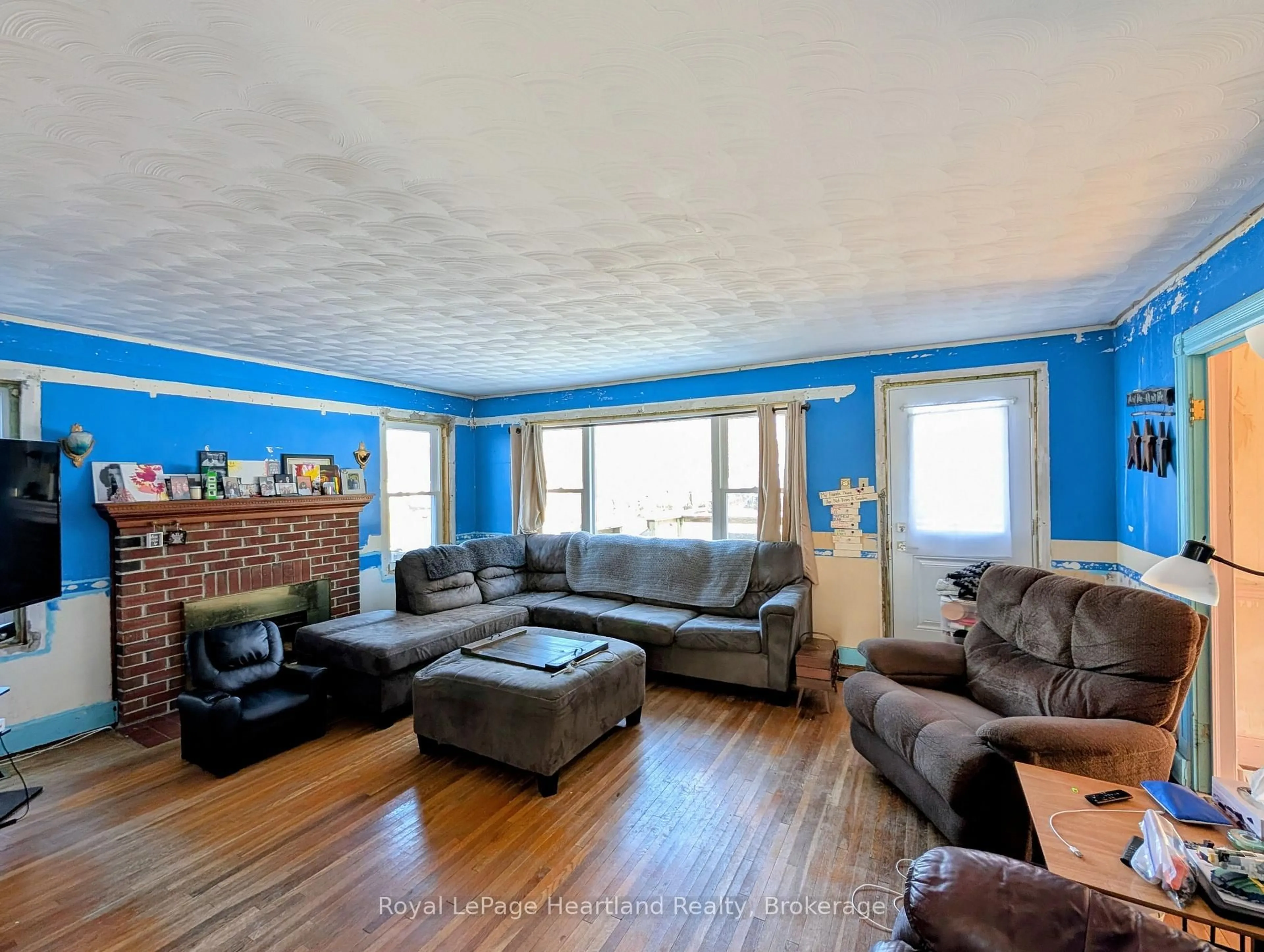 Living room with furniture, wood/laminate floor for 80 Joseph St, Central Huron Ontario N0M 1L0