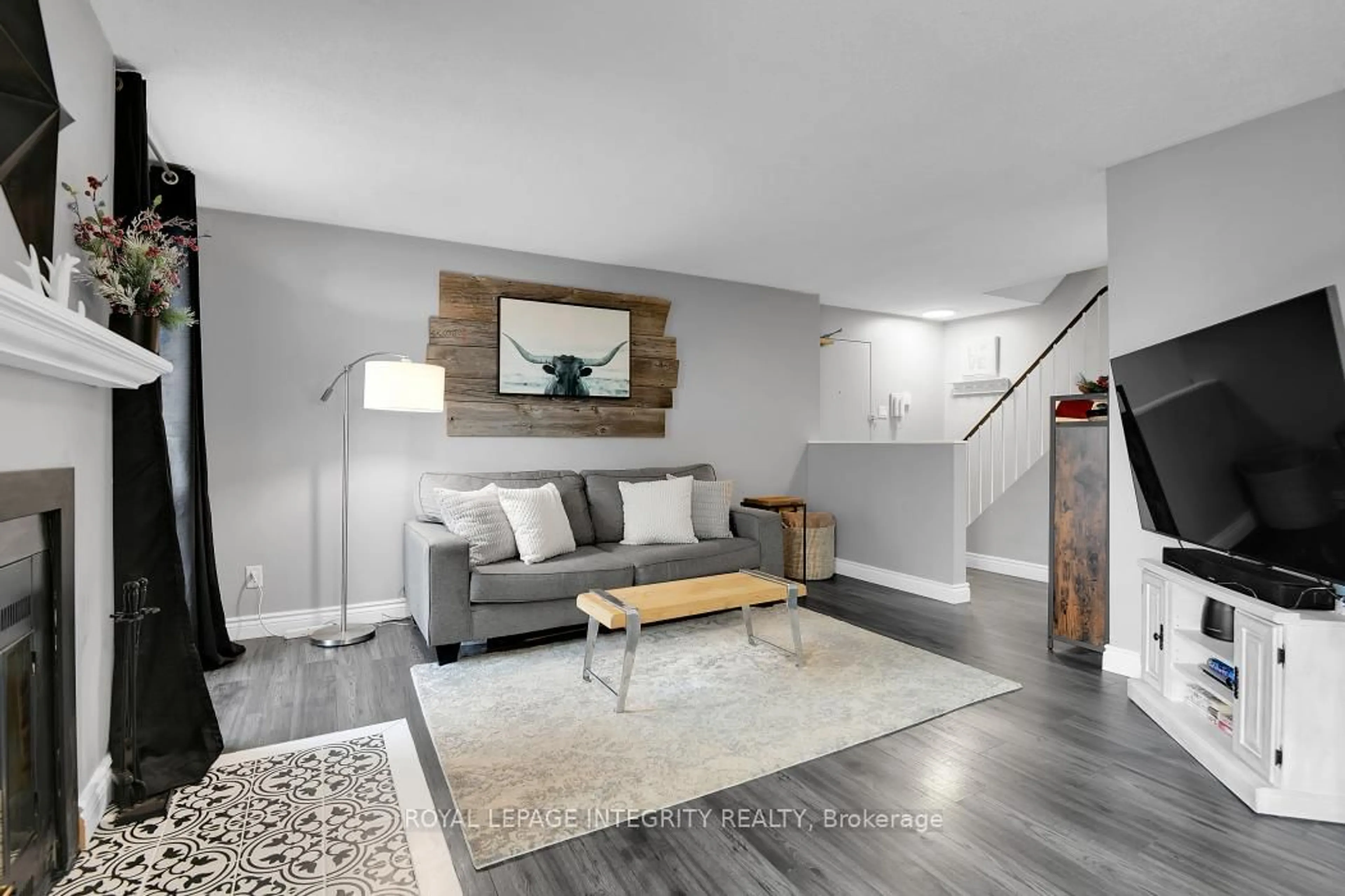 Living room with furniture, wood/laminate floor for 20 Sweetbriar Circ ##6, Ottawa Ontario K2J 2K4