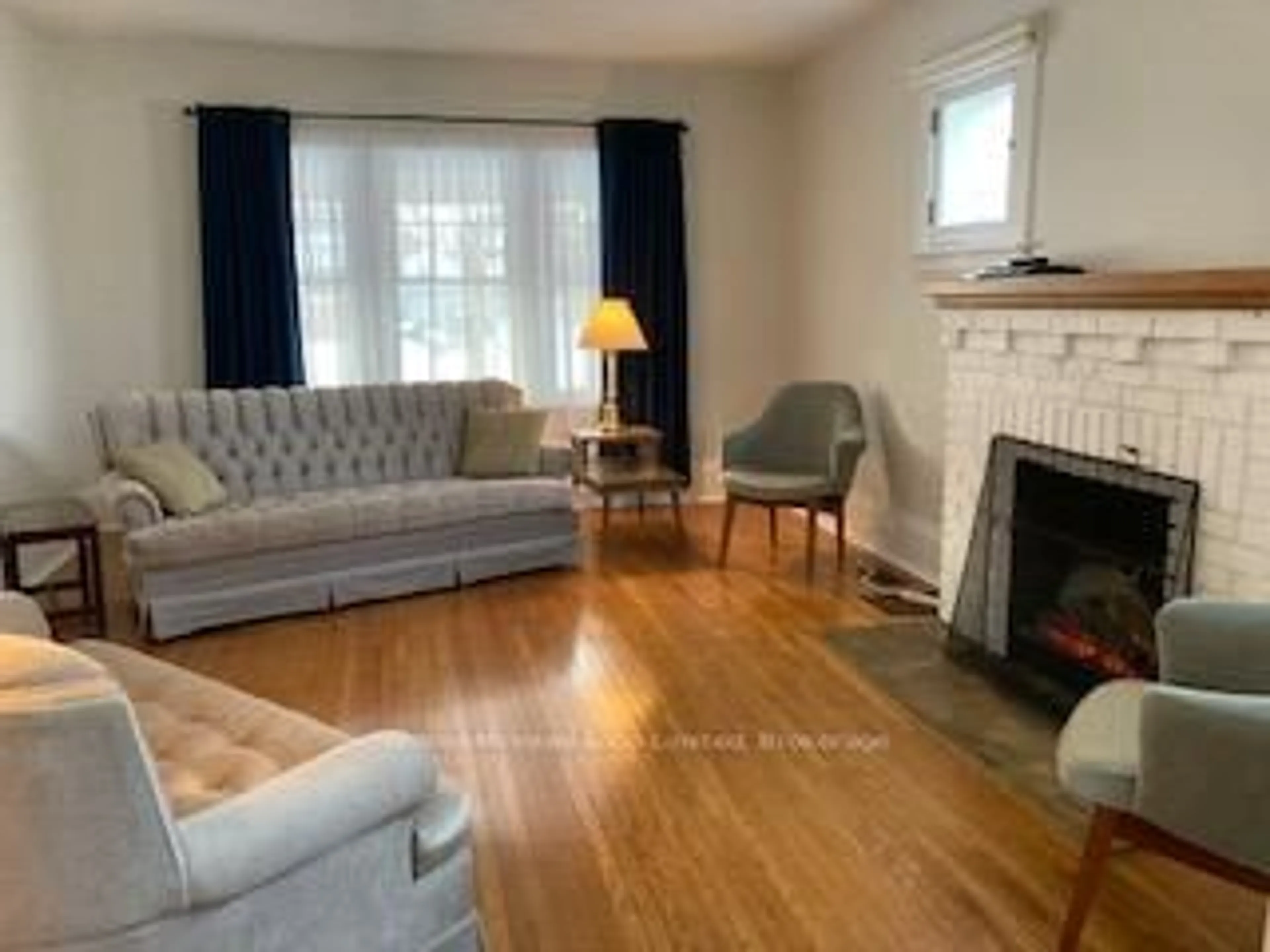 Living room with furniture, wood/laminate floor for 376 Lambton St, West Grey Ontario N0G 1R0