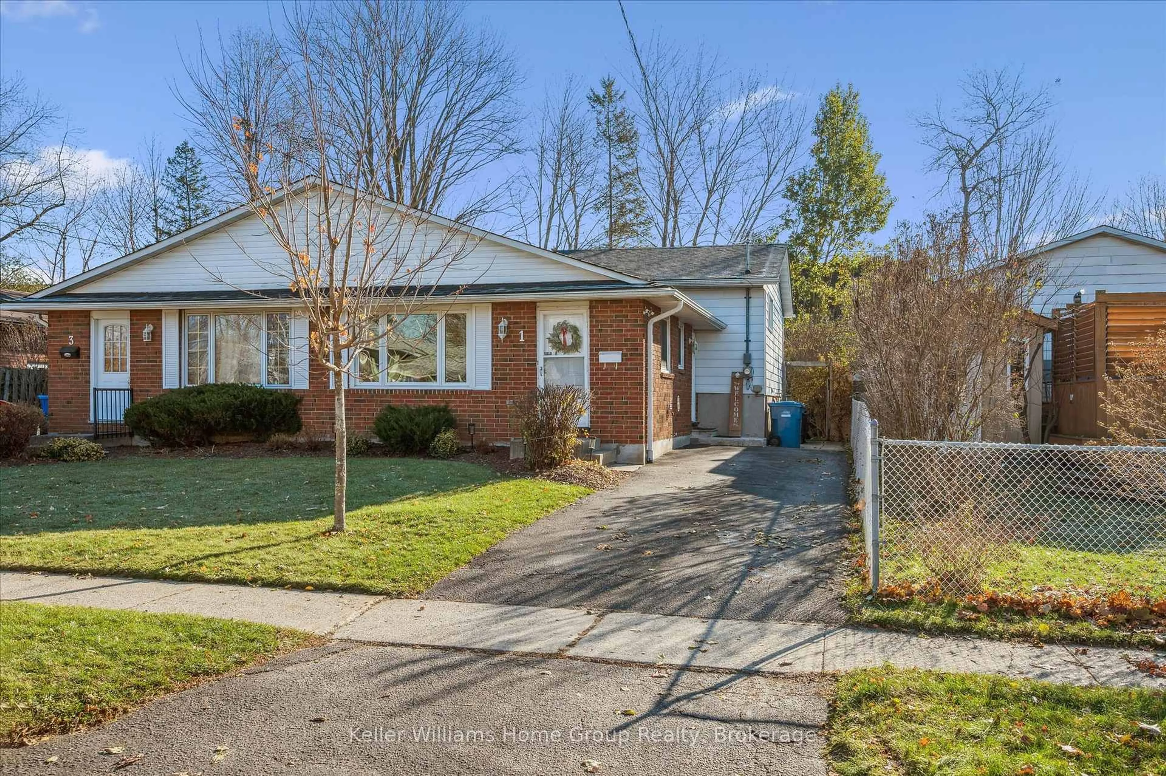 Home with brick exterior material, street for 1 Islington Ave, Guelph Ontario N1E 1B2