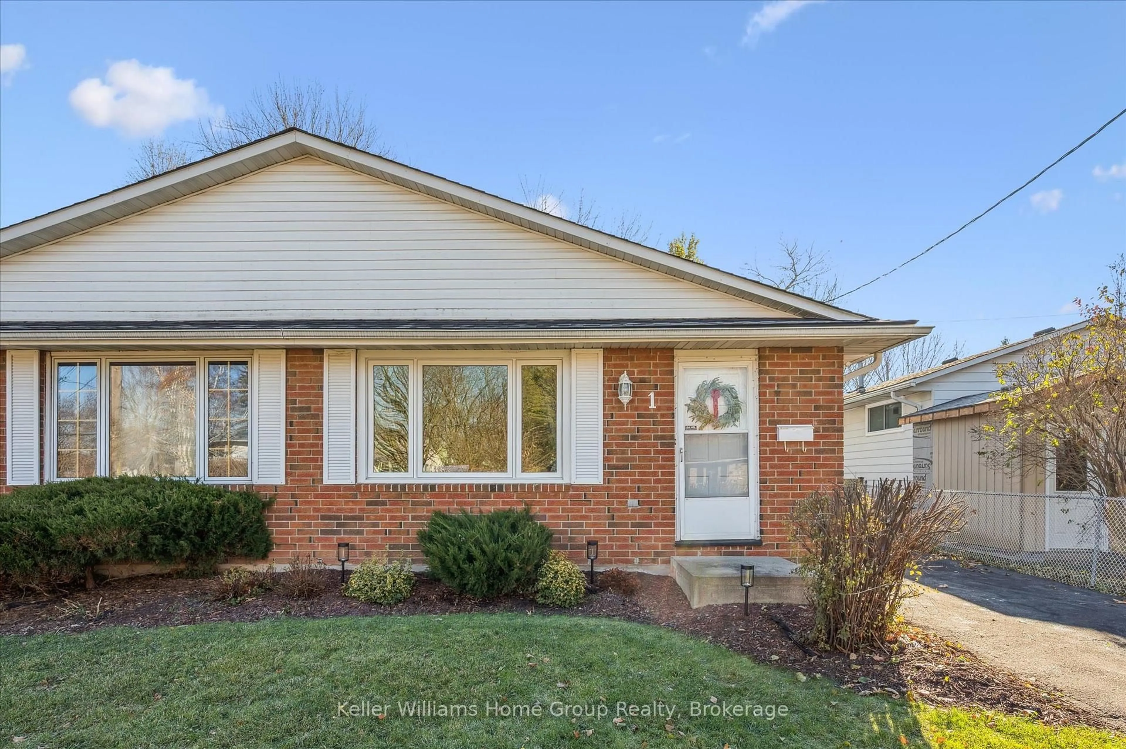 Home with brick exterior material, street for 1 Islington Ave, Guelph Ontario N1E 1B2