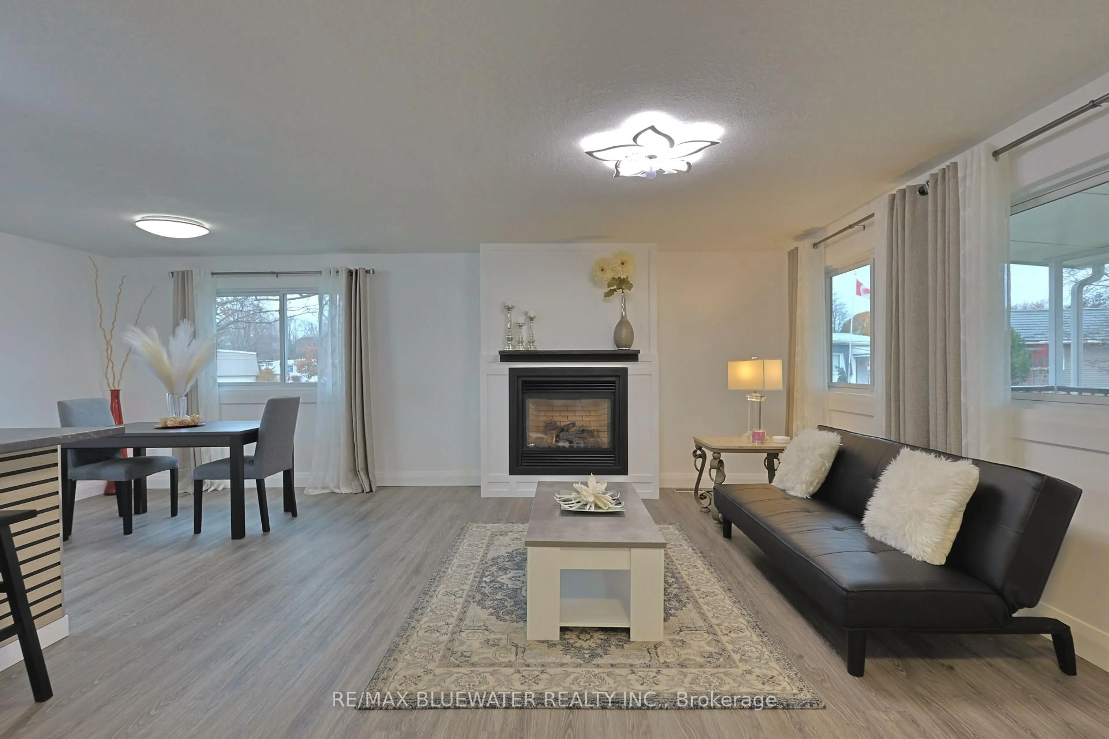 Living room with furniture, wood/laminate floor for 46 St Andrews Pl, South Huron Ontario N0M 1T0