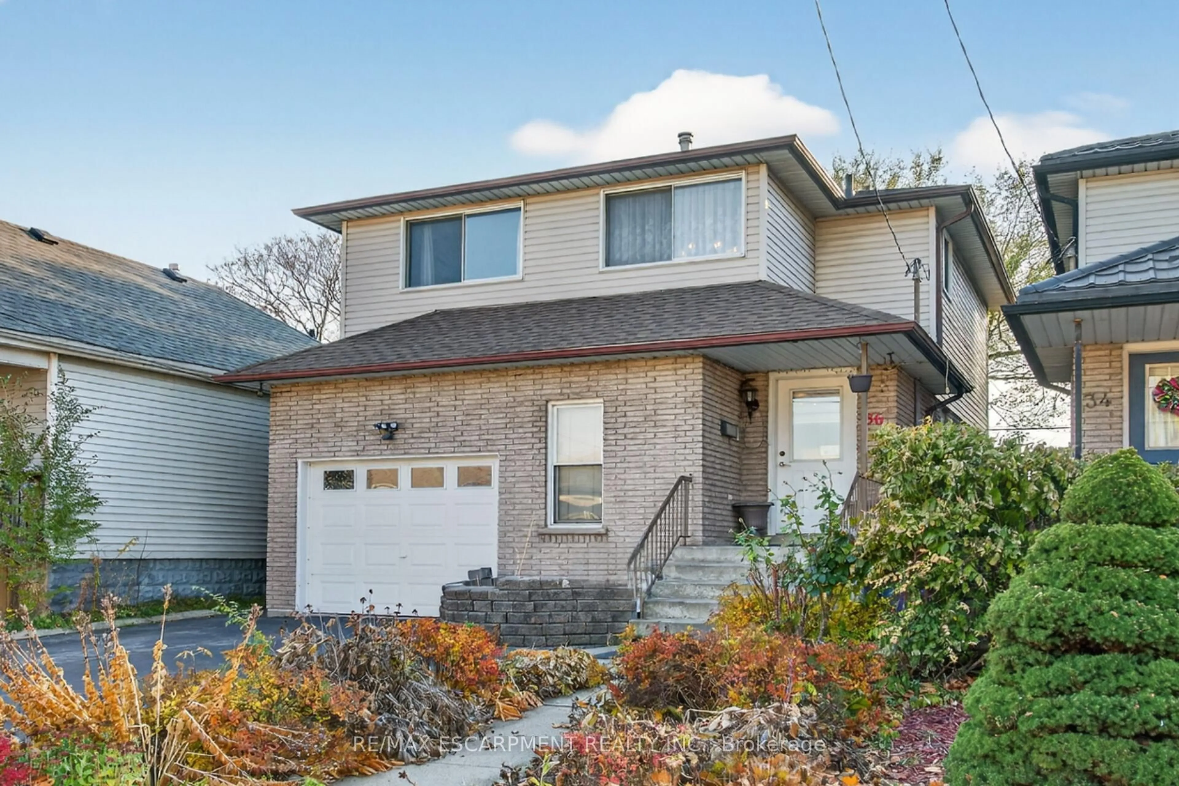 Home with brick exterior material, street for 36 Cluny Ave, Hamilton Ontario L8L 3H8