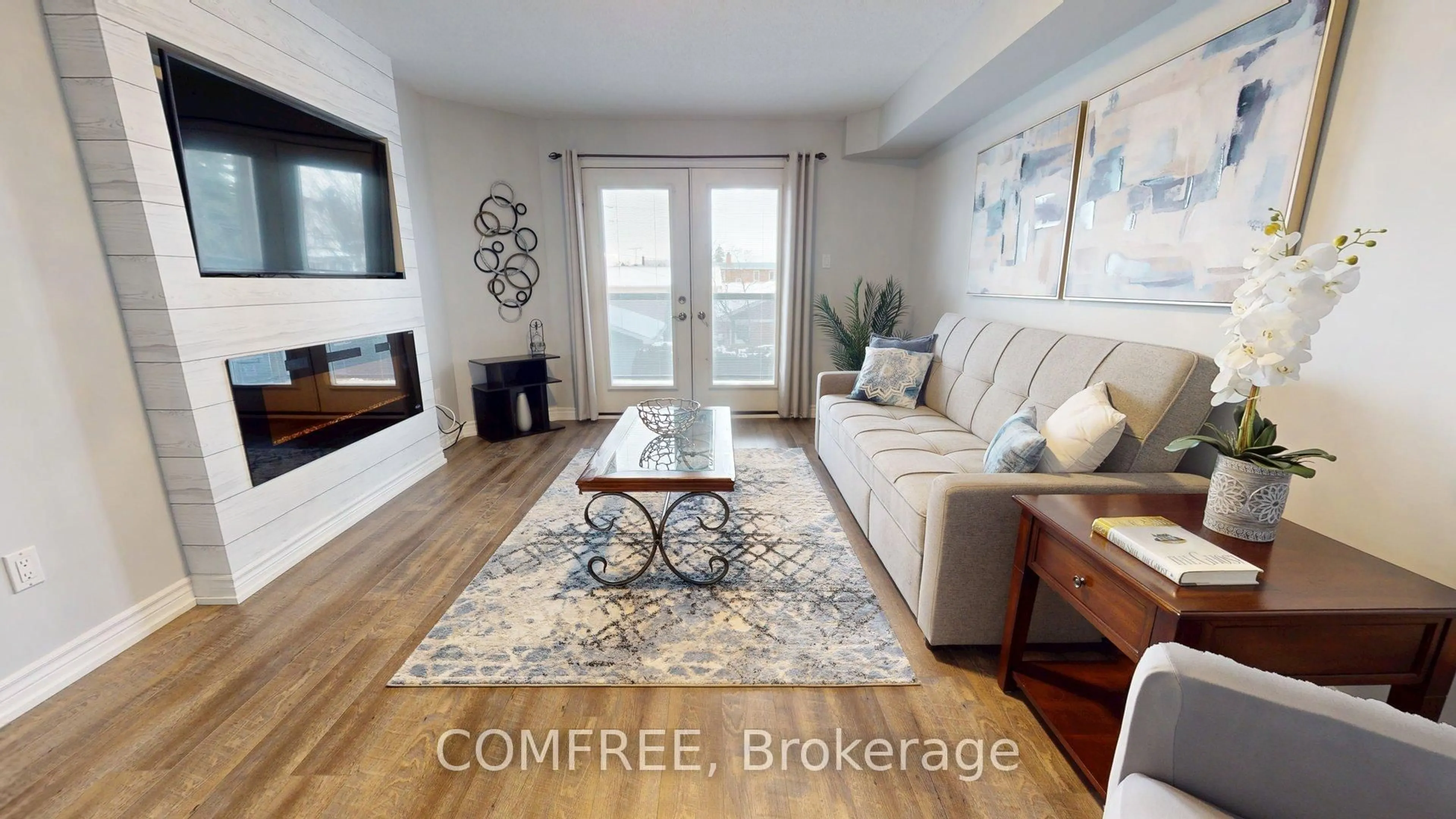 Living room with furniture, wood/laminate floor for 770 Principale St #204, Casselman Ontario K0A 1M0