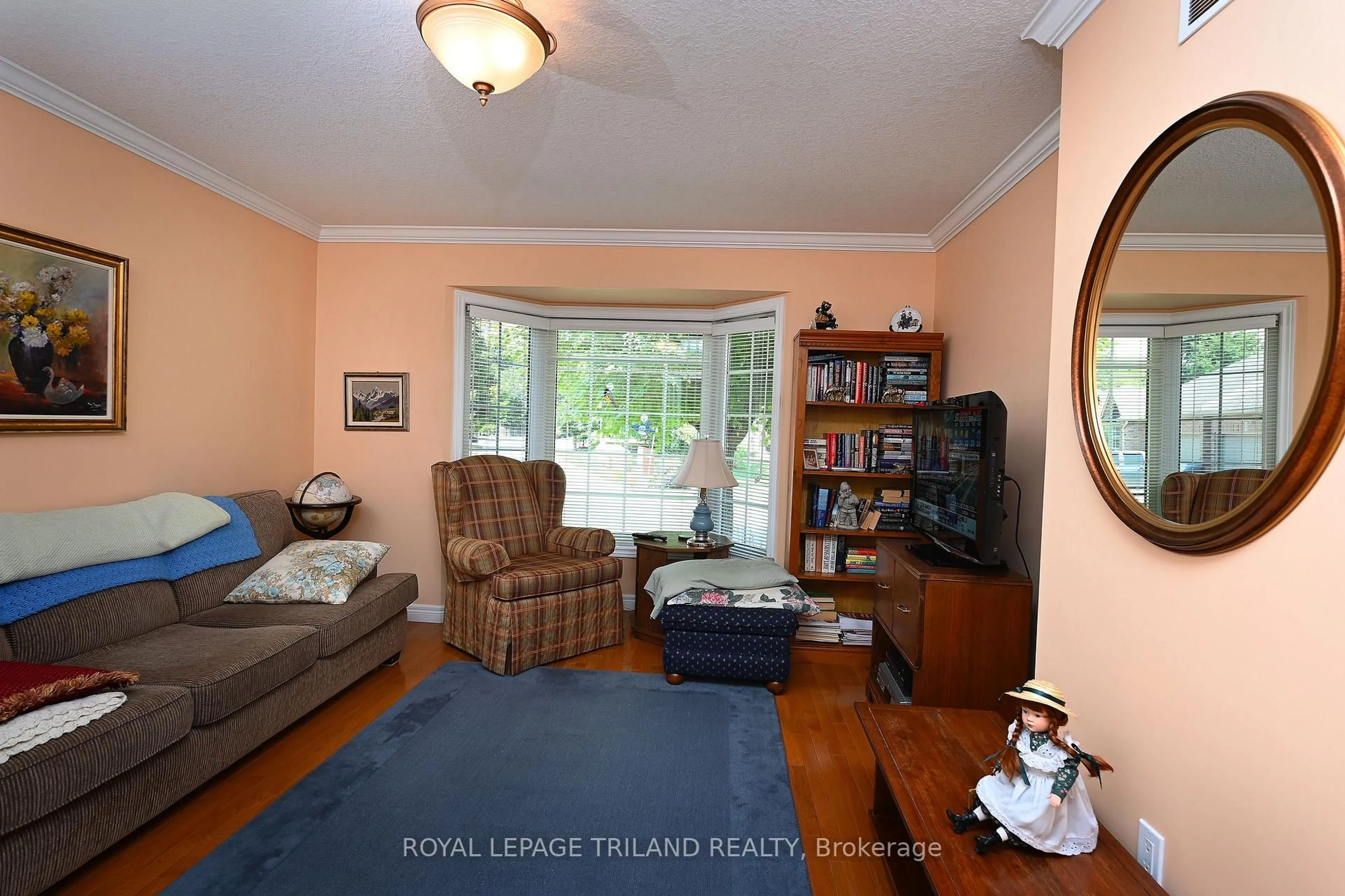Living room with furniture, wood/laminate floor for 4067 COLONEL TALBOT Rd #5, London South Ontario N6P 1V9