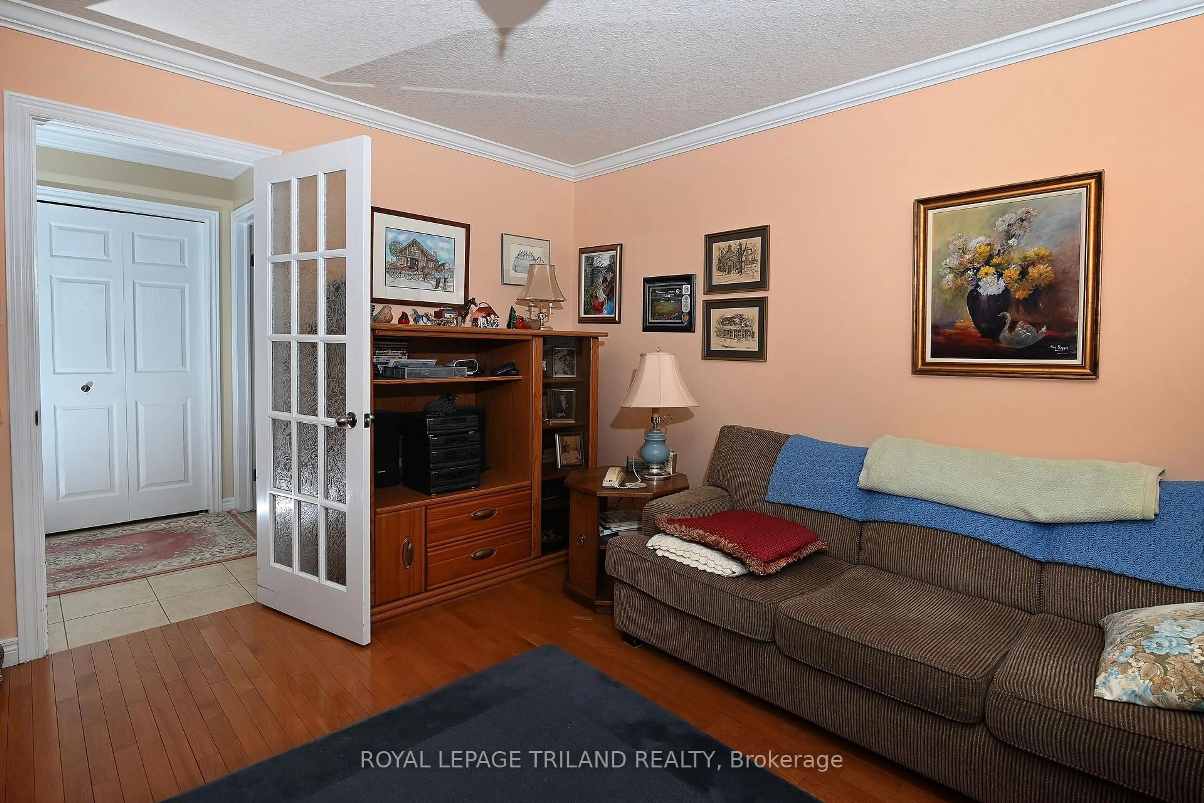 Living room with furniture, wood/laminate floor for 4067 COLONEL TALBOT Rd #5, London South Ontario N6P 1V9