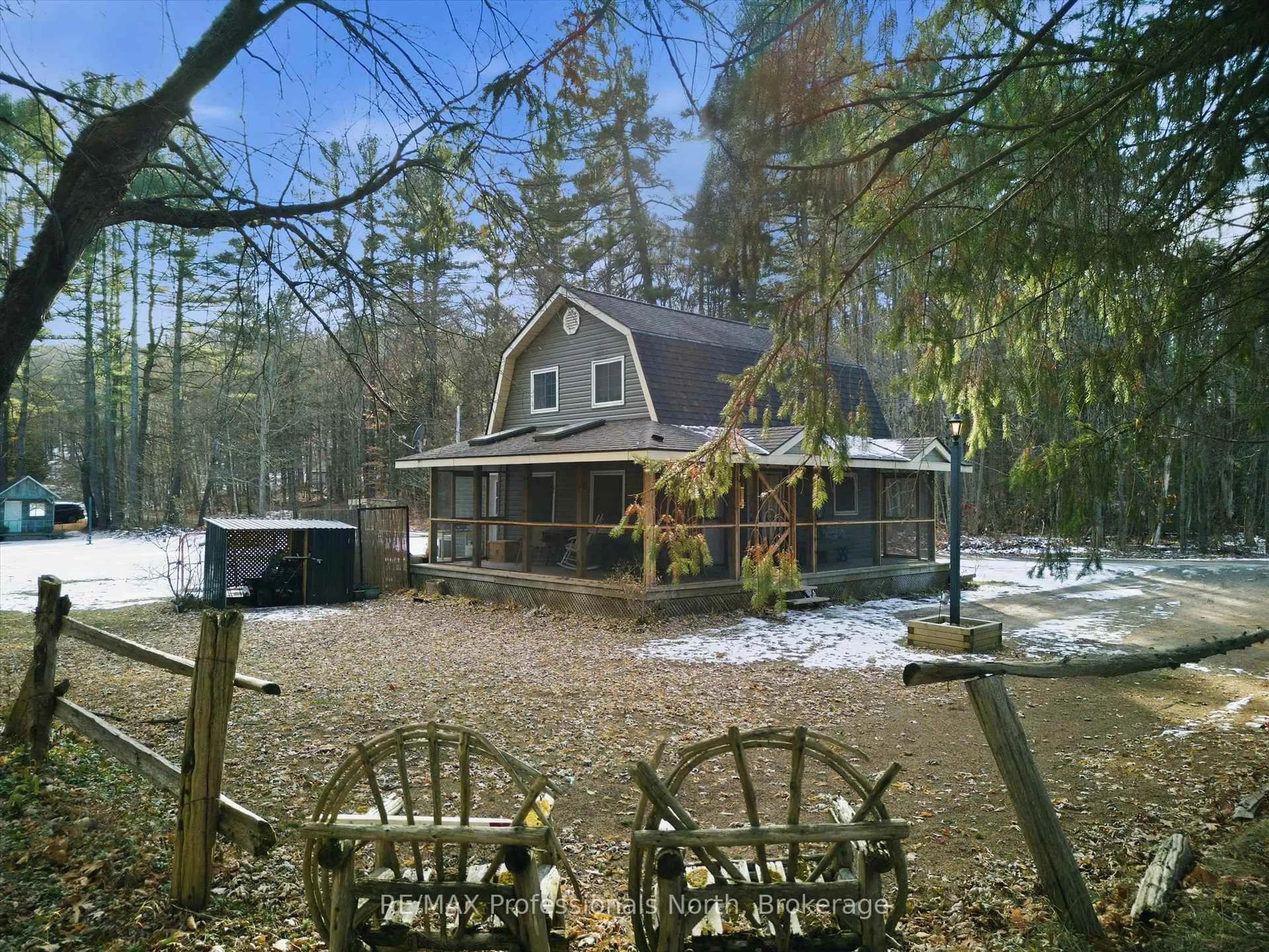 A pic from outside/outdoor area/front of a property/back of a property/a pic from drone, forest/trees view for 185 Muskoka Rd 10 Rd, Huntsville Ontario P0B 1L0