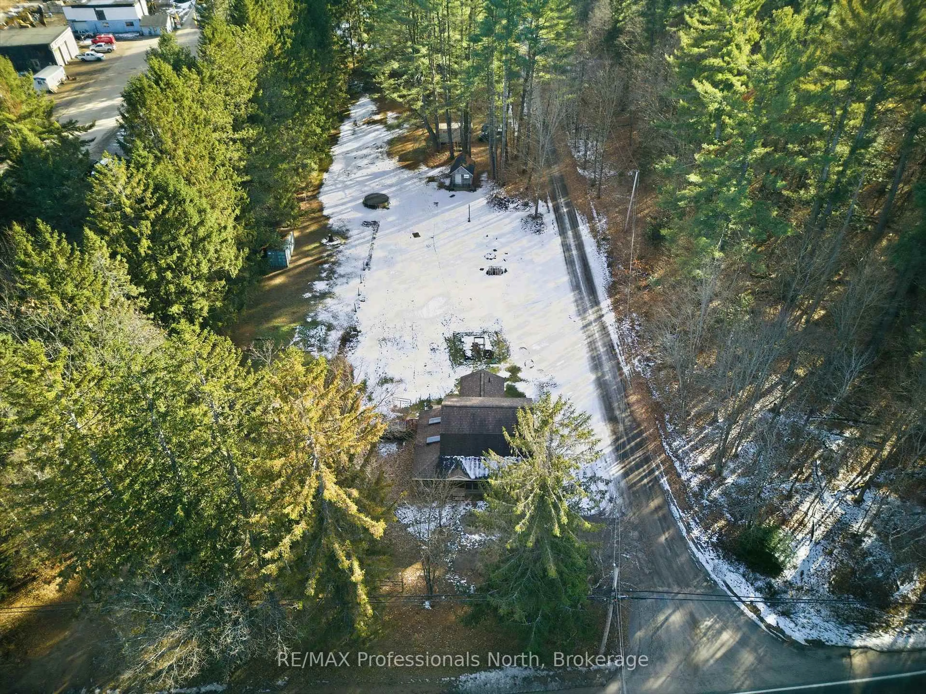 A pic from outside/outdoor area/front of a property/back of a property/a pic from drone, forest/trees view for 185 Muskoka Rd 10 Rd, Huntsville Ontario P0B 1L0