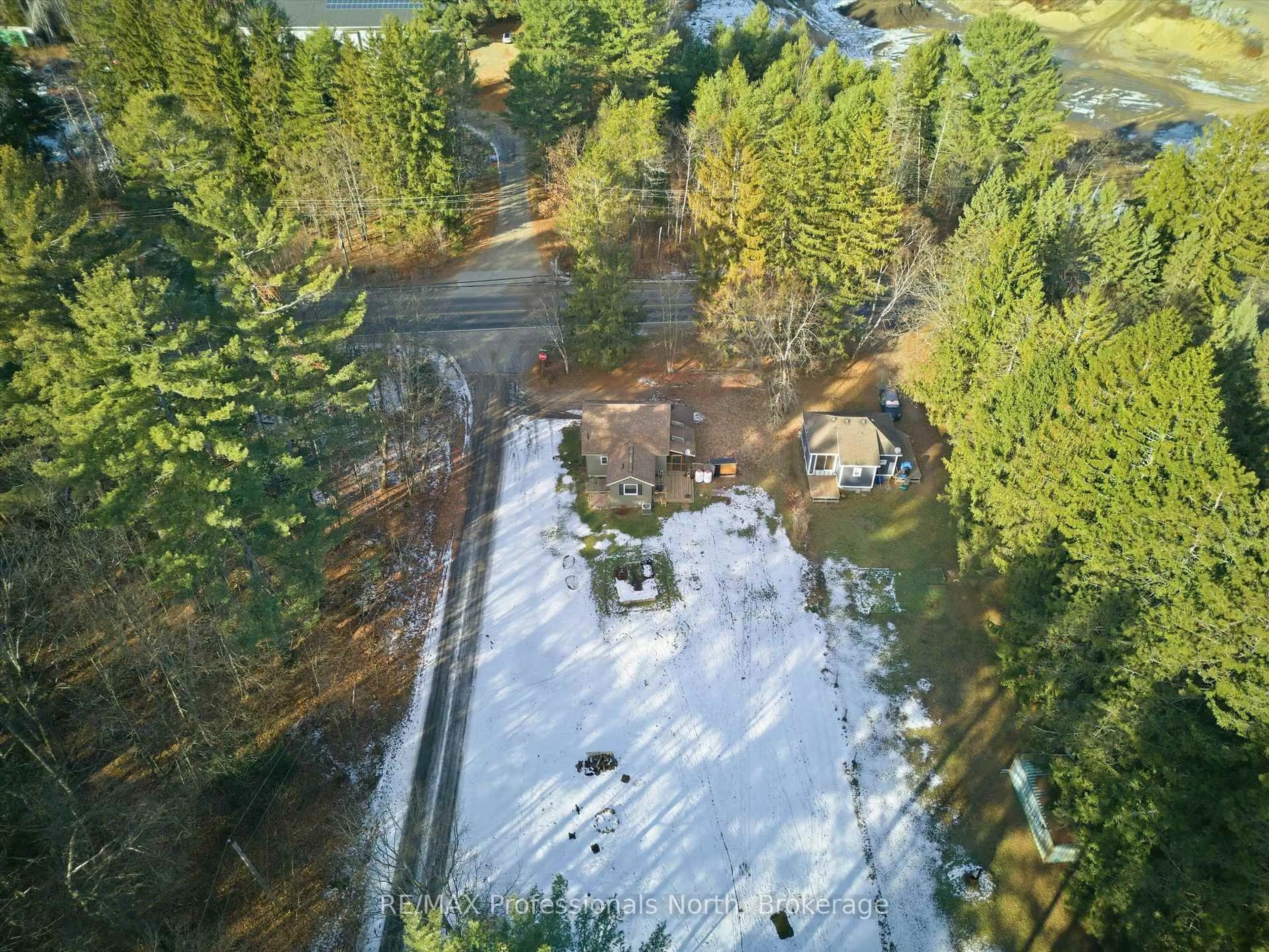 A pic from outside/outdoor area/front of a property/back of a property/a pic from drone, forest/trees view for 185 Muskoka Rd 10 Rd, Huntsville Ontario P0B 1L0